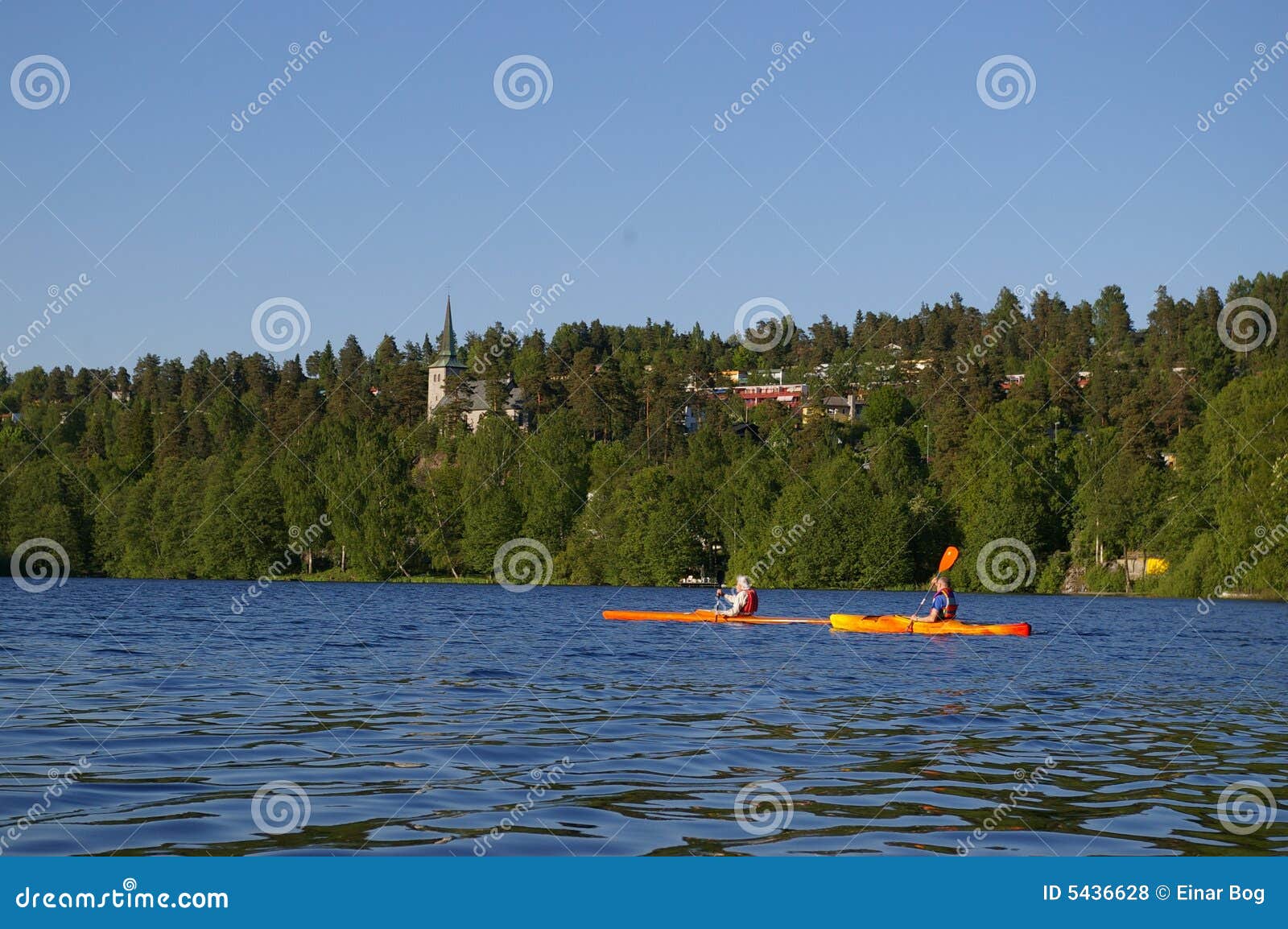 Scenic view of two canoeists on lake Kolbotnvannet, Akershus county ...