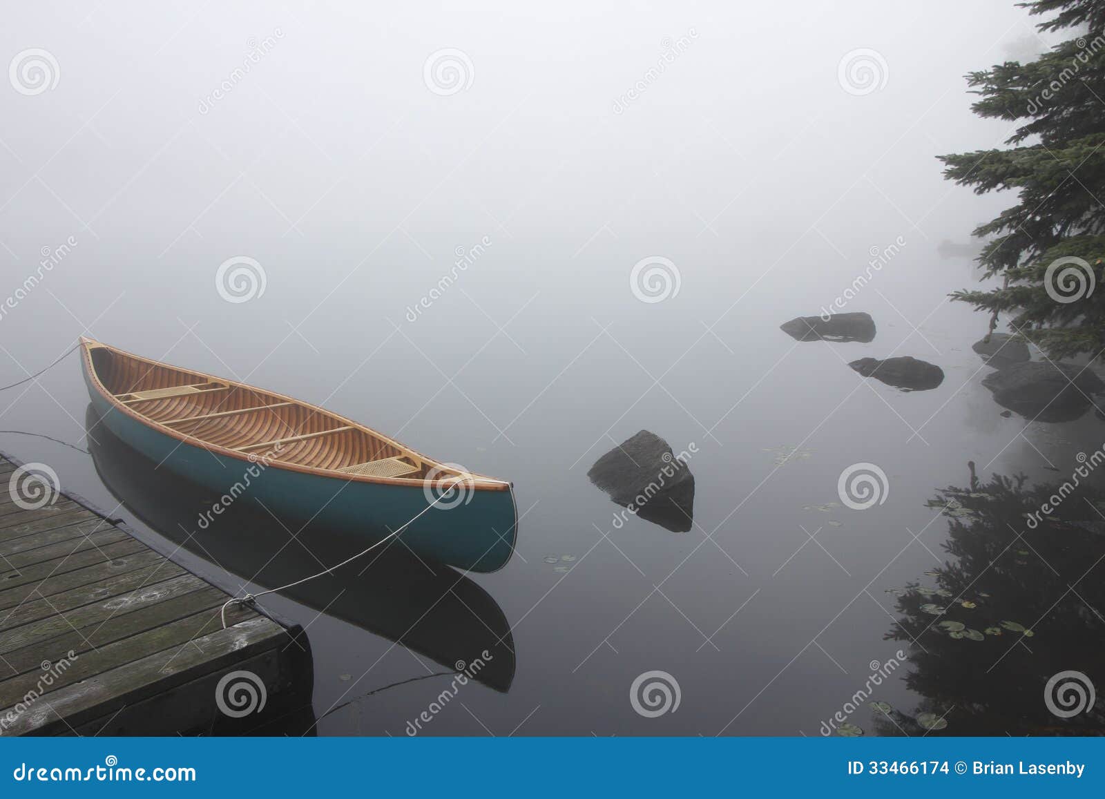 Canvas Cedar Canoe Tied to a Dock on a Misty Morning - Haliburton 