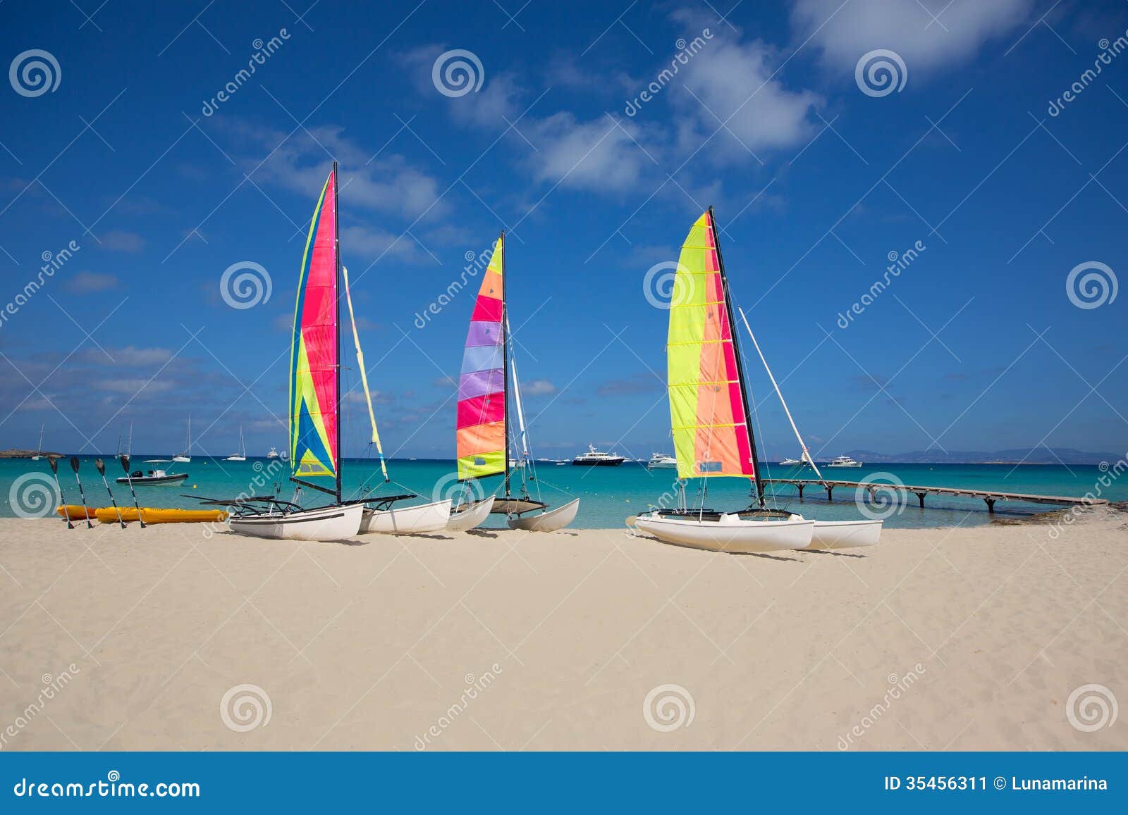 Catamaran sailboats in Illetes Formentera beach at Balearic Islands.