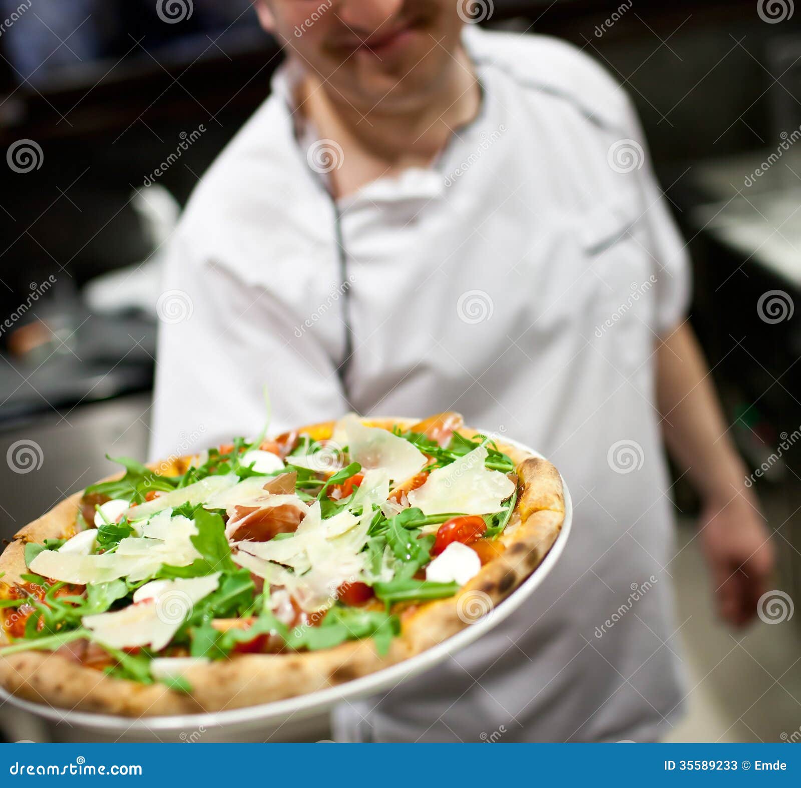 Chef Making Pizza At Kitchen Stock Photos - Image: 35589233