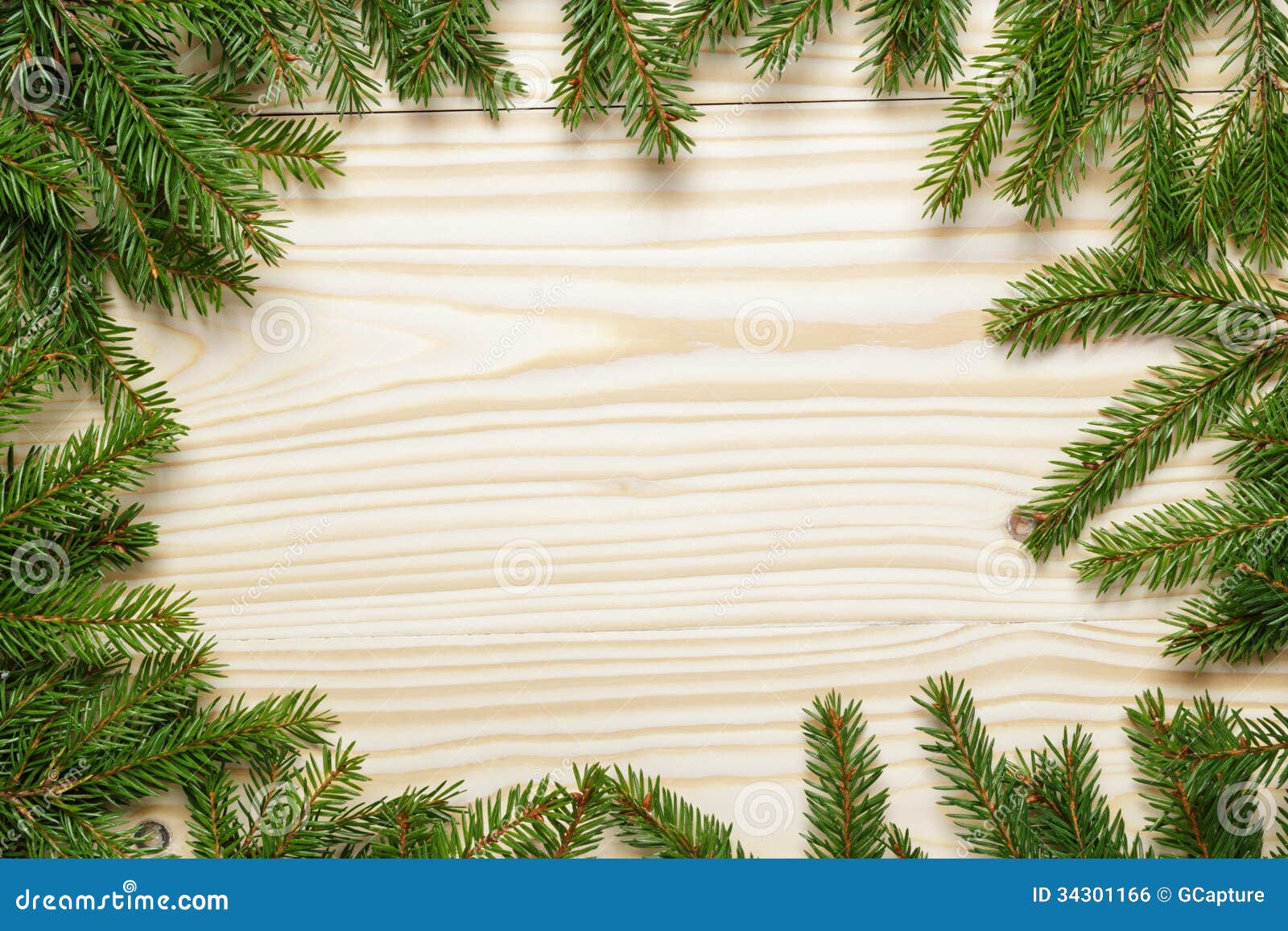 Christmas Background From Fir Twigs On Wooden Table 