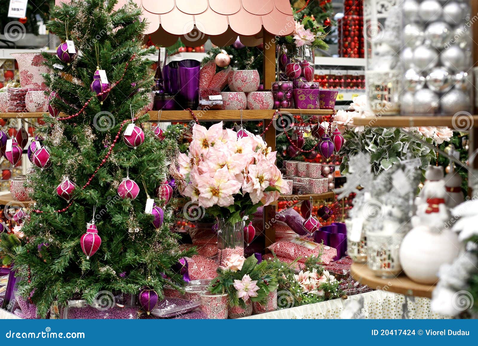 Christmas decorations store with artificial christmas tree, balls ...