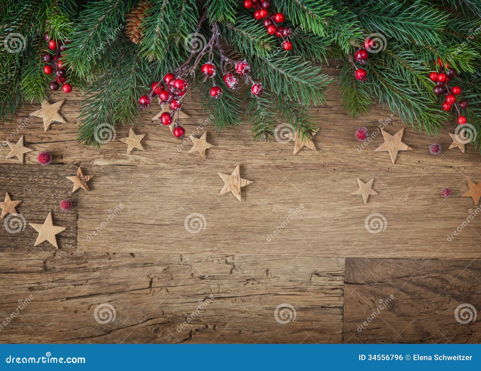 Christmas fir tree on wooden background.