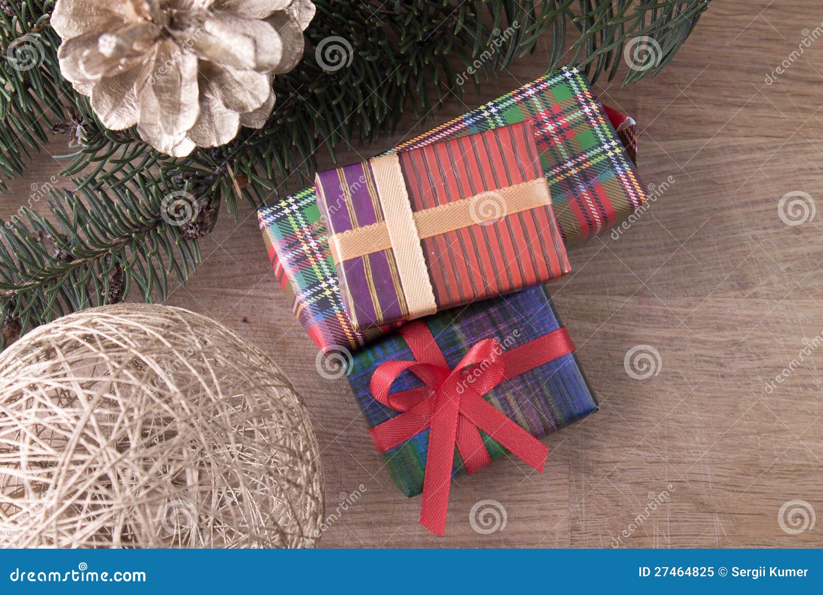 Christmas decoration with gifts on old wood background.