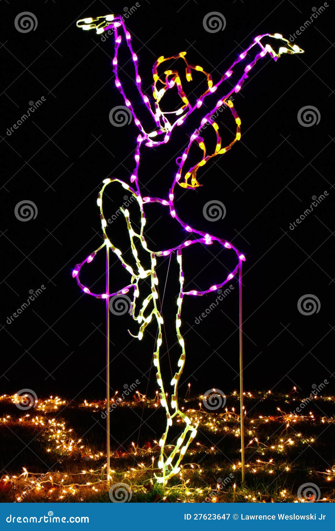 colorful christmas holiday light display of a figure skater.