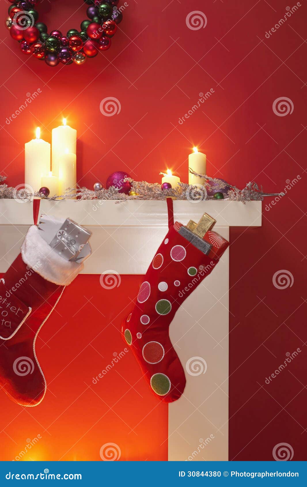 Christmas Stockings Hanging Over Fireplace Stock Photo