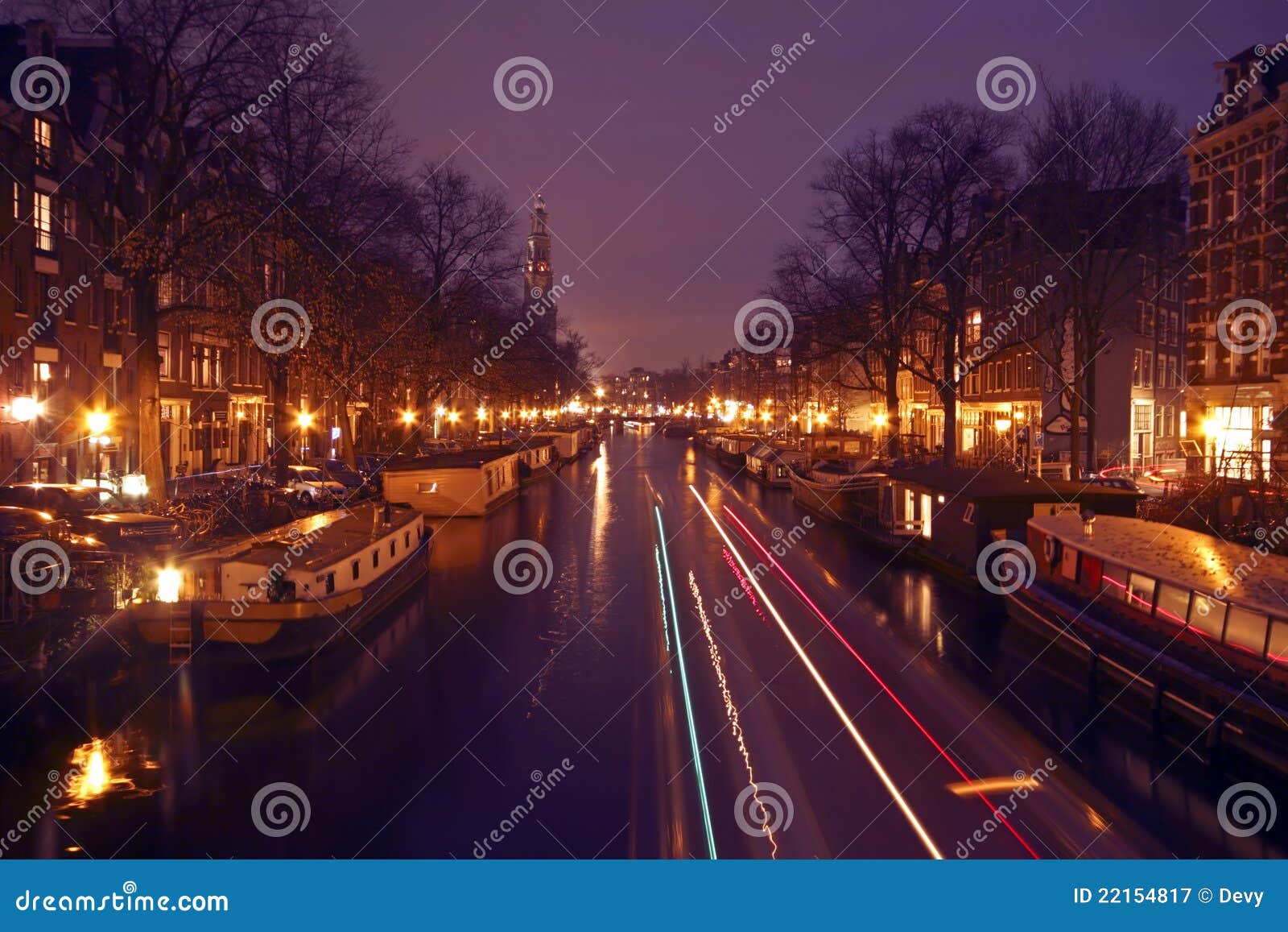 City scenic in Amsterdam the Netherlands with the westerkerk at night.