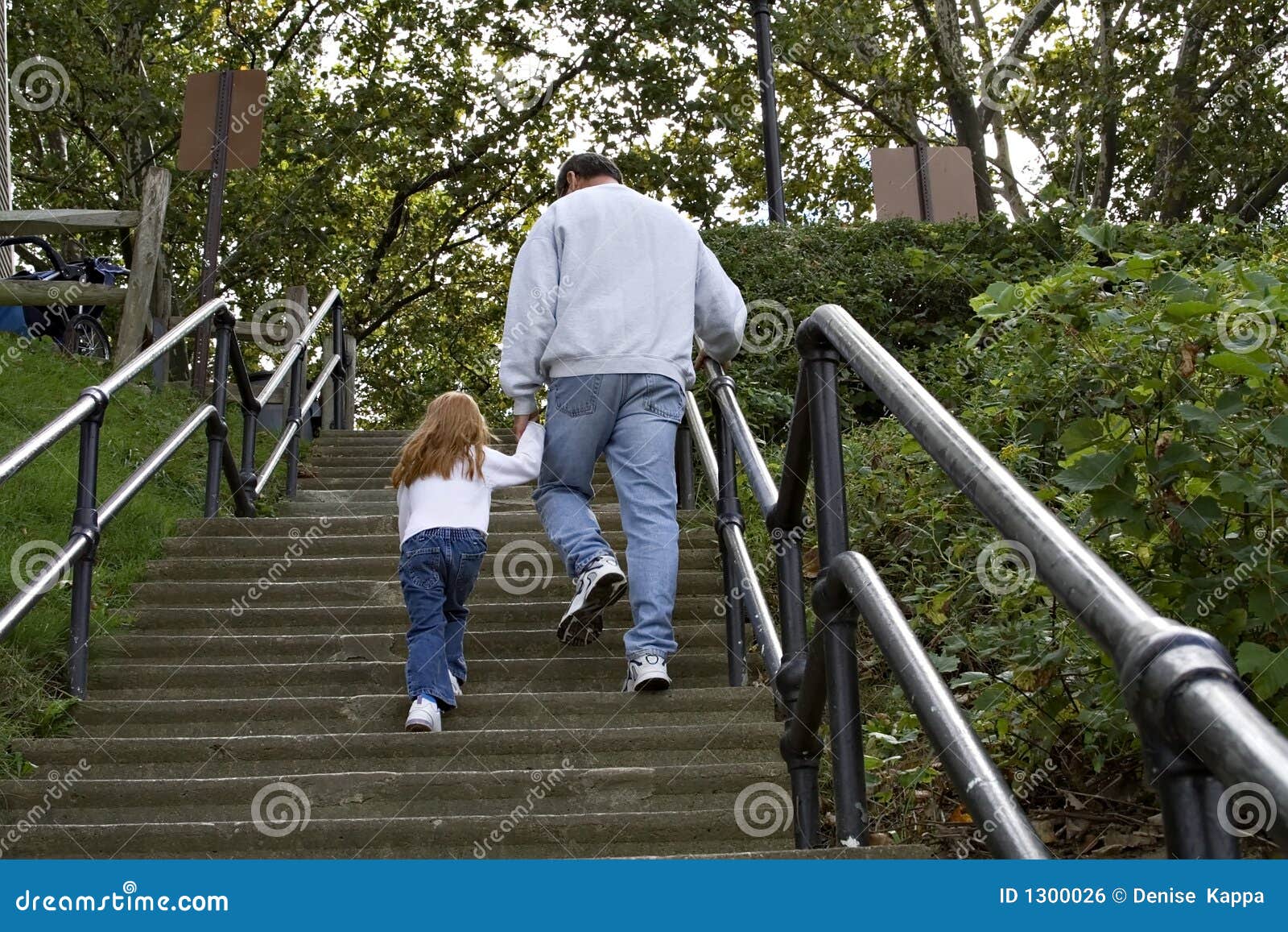 Parents with Children Climbing Steps