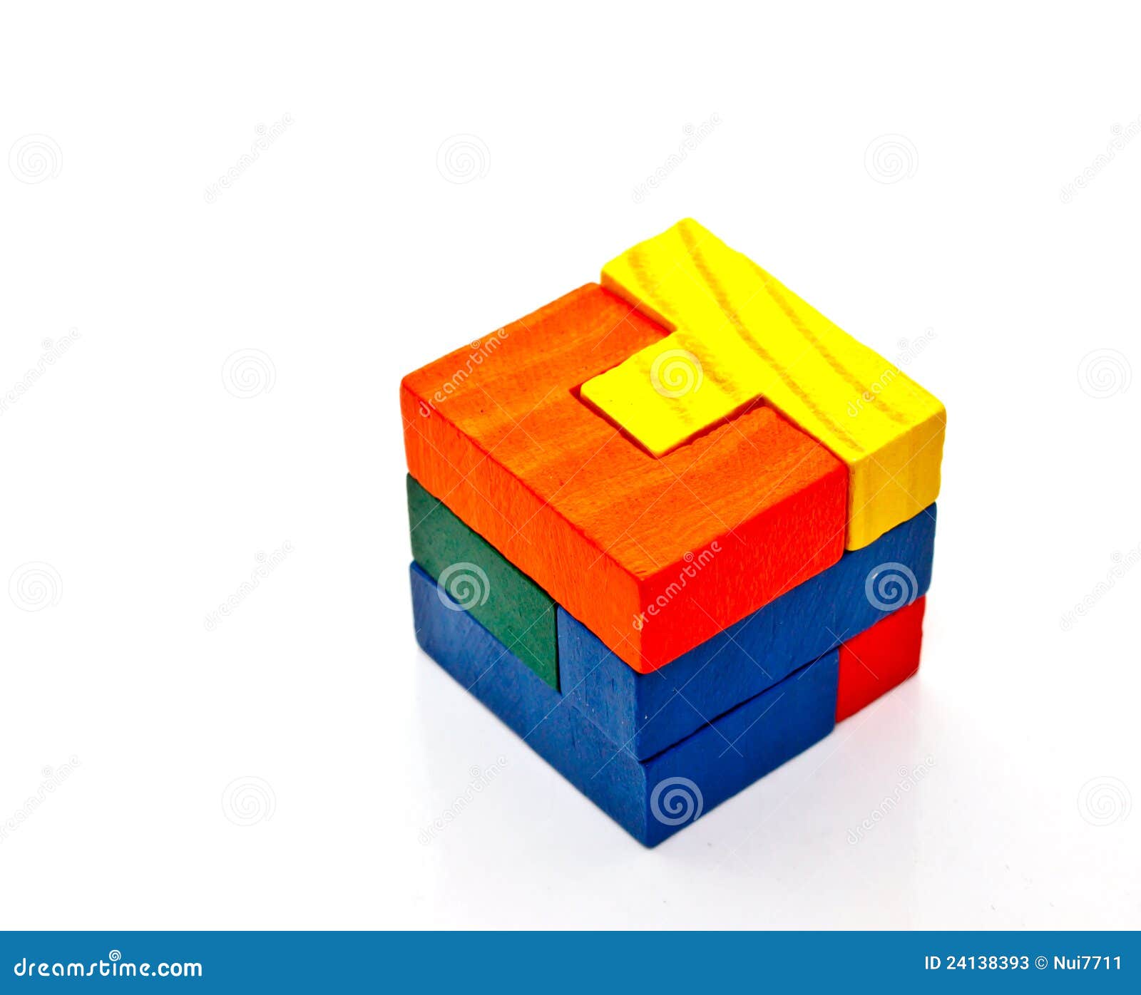 Colorful wooden jigsaw on white background.
