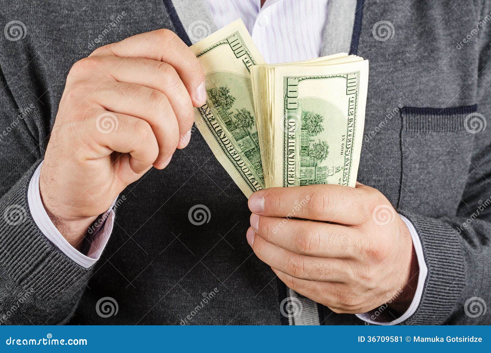  - concept-finance-success-businessman-holding-cash-dollars-hands-36709581