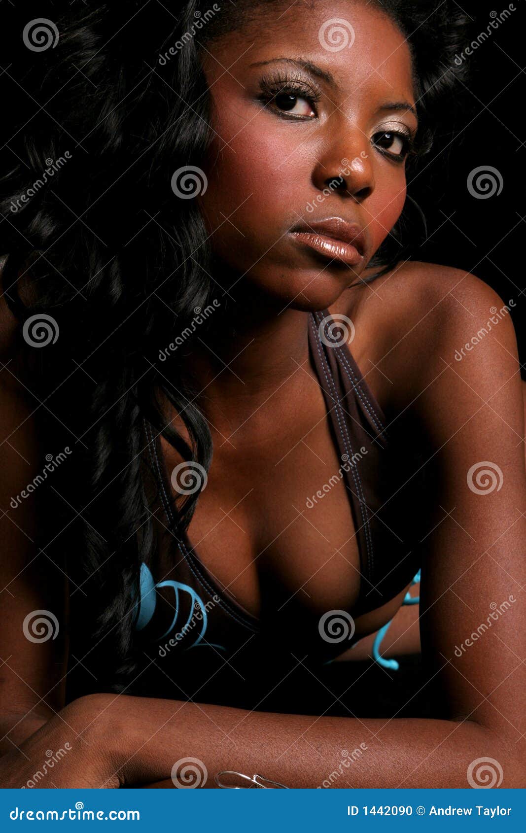 Bikini Model Posing On The Rocks Royalty Free Stock Photography