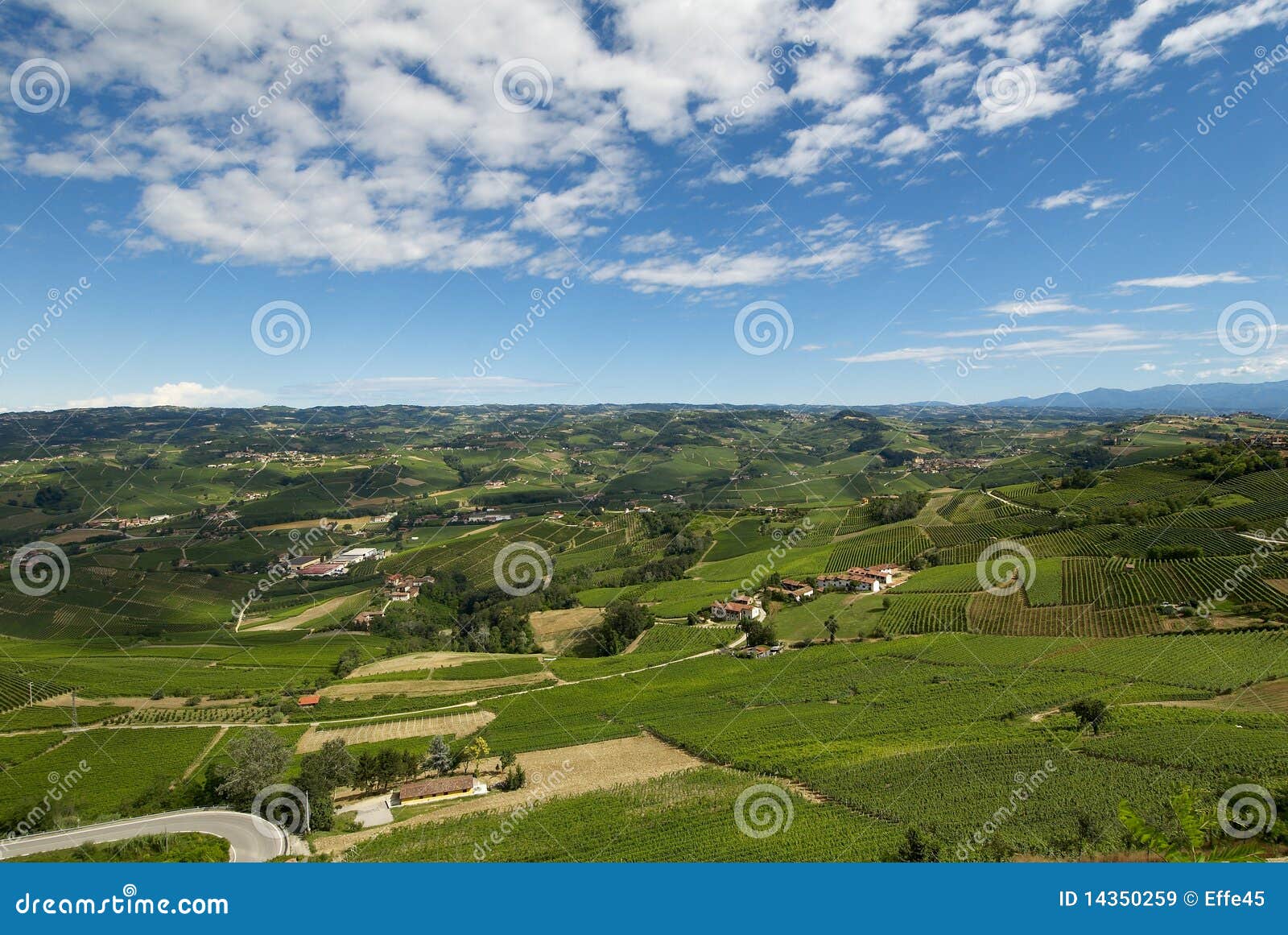 Country landscape in piedmont with blue and cloudy sky.