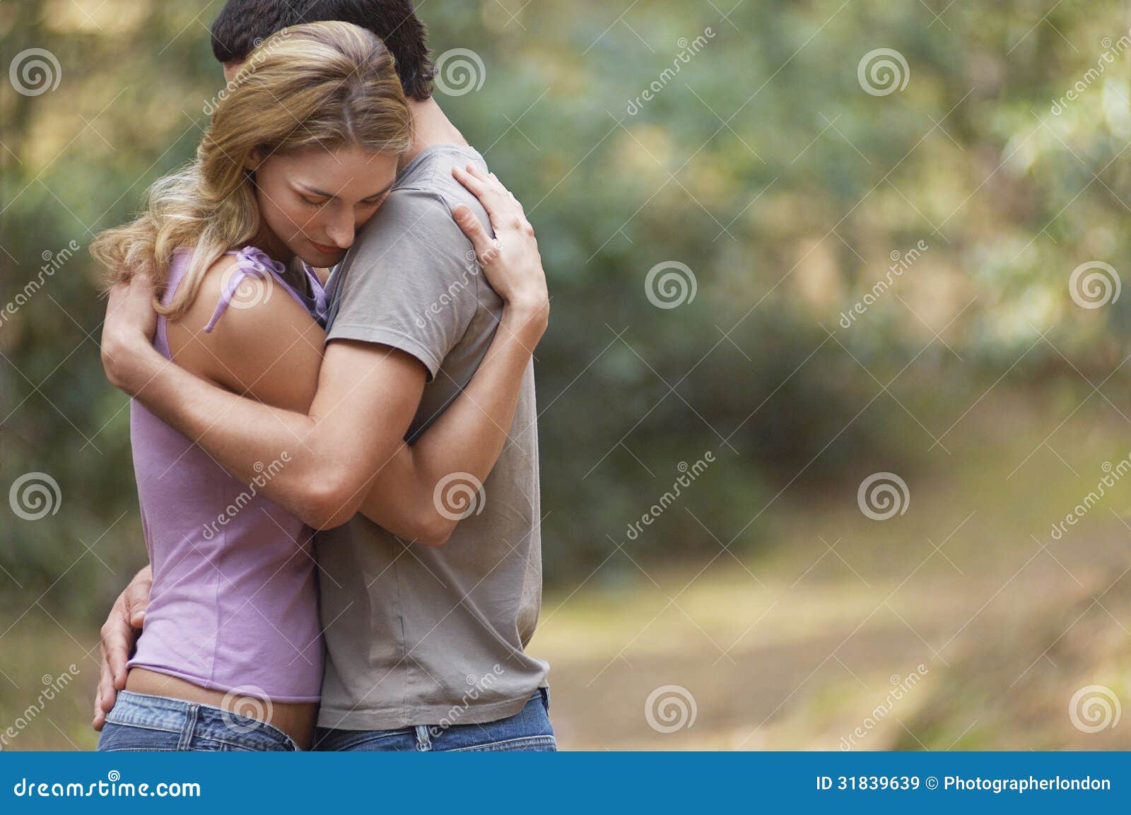 [Image: couple-hugging-forest-side-view-standing...839639.jpg]