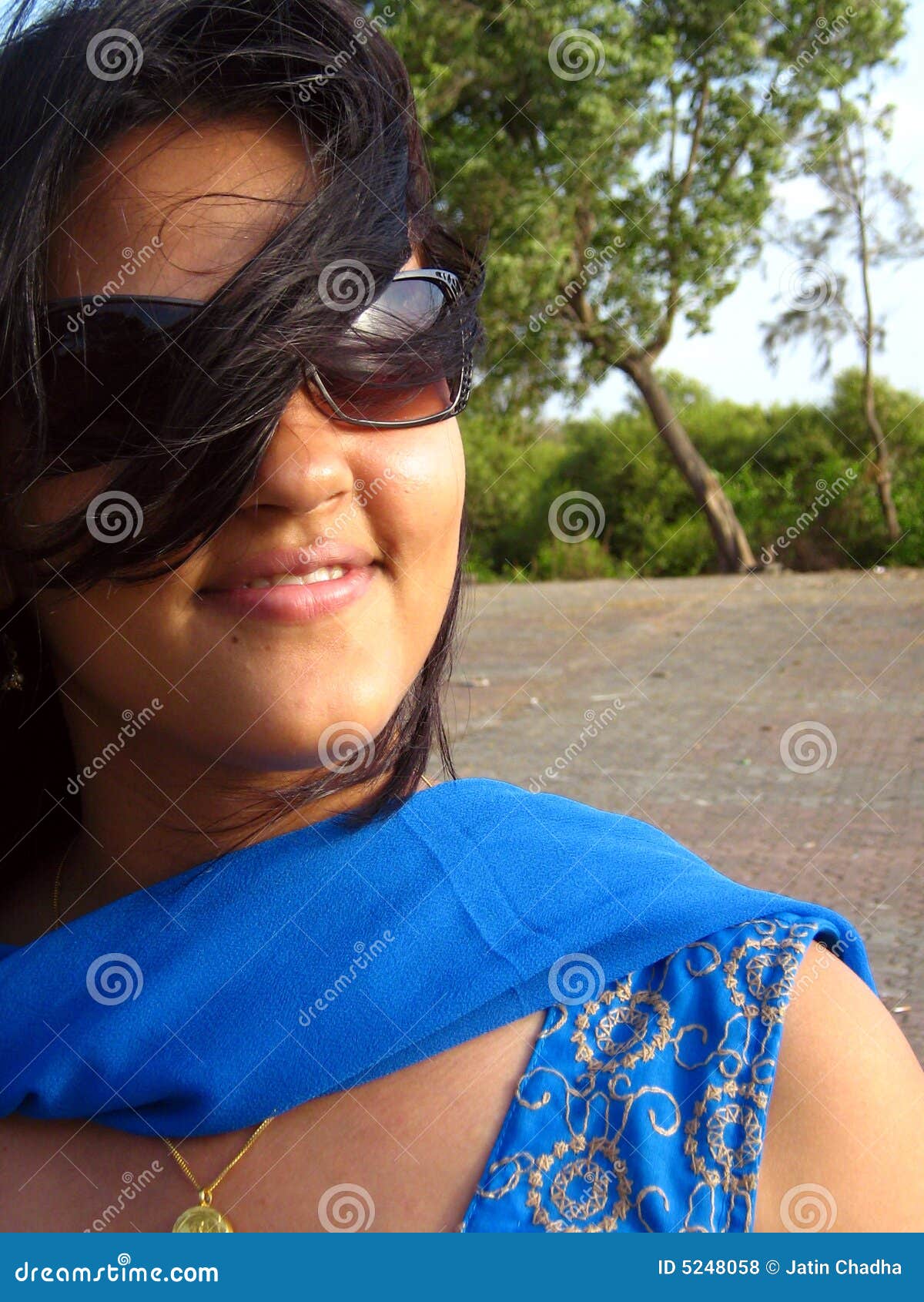 Cute Girl Smiling Wearing Sunglasses Royalty Free Stock