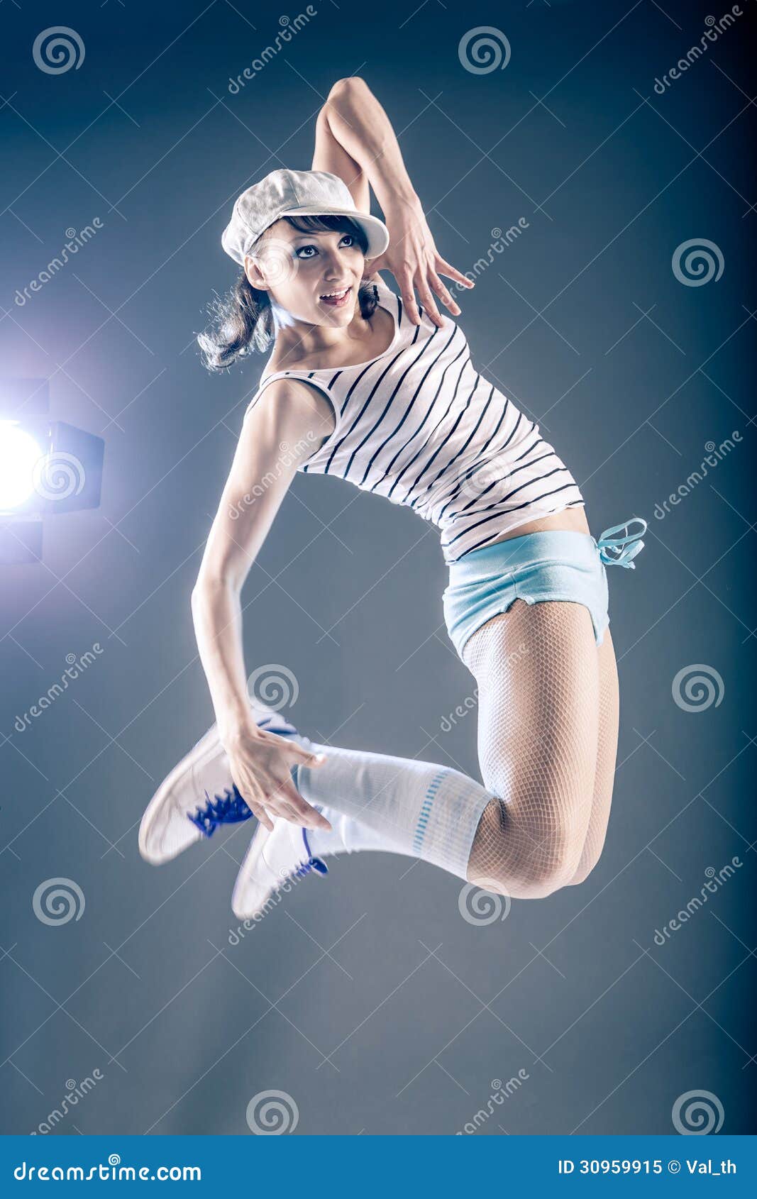 Young Woman In Sport Dress Dancing In Zumba Or Reggaeton Or Hiphop Young Woman In Sport Dress Dancing In Zumba Or Reggaeton Or Hiphop