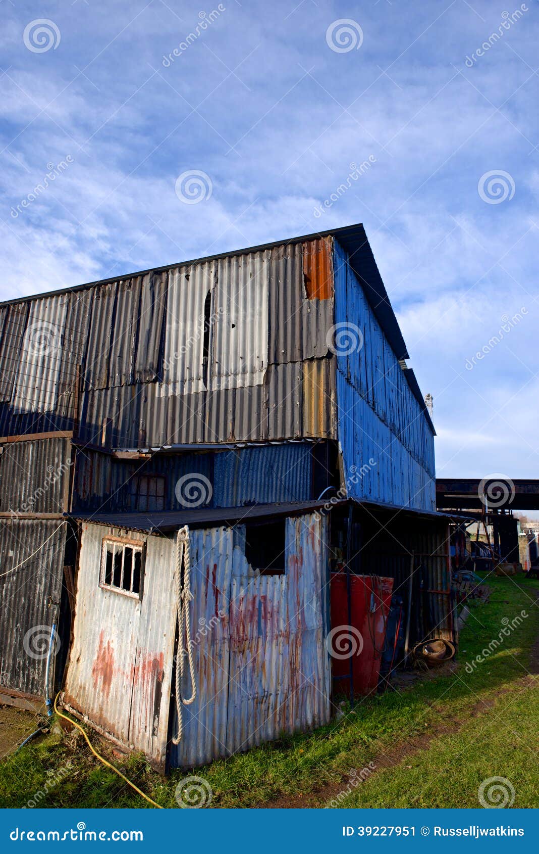Ramshackle corrugated steel building - vertical format with copy space 