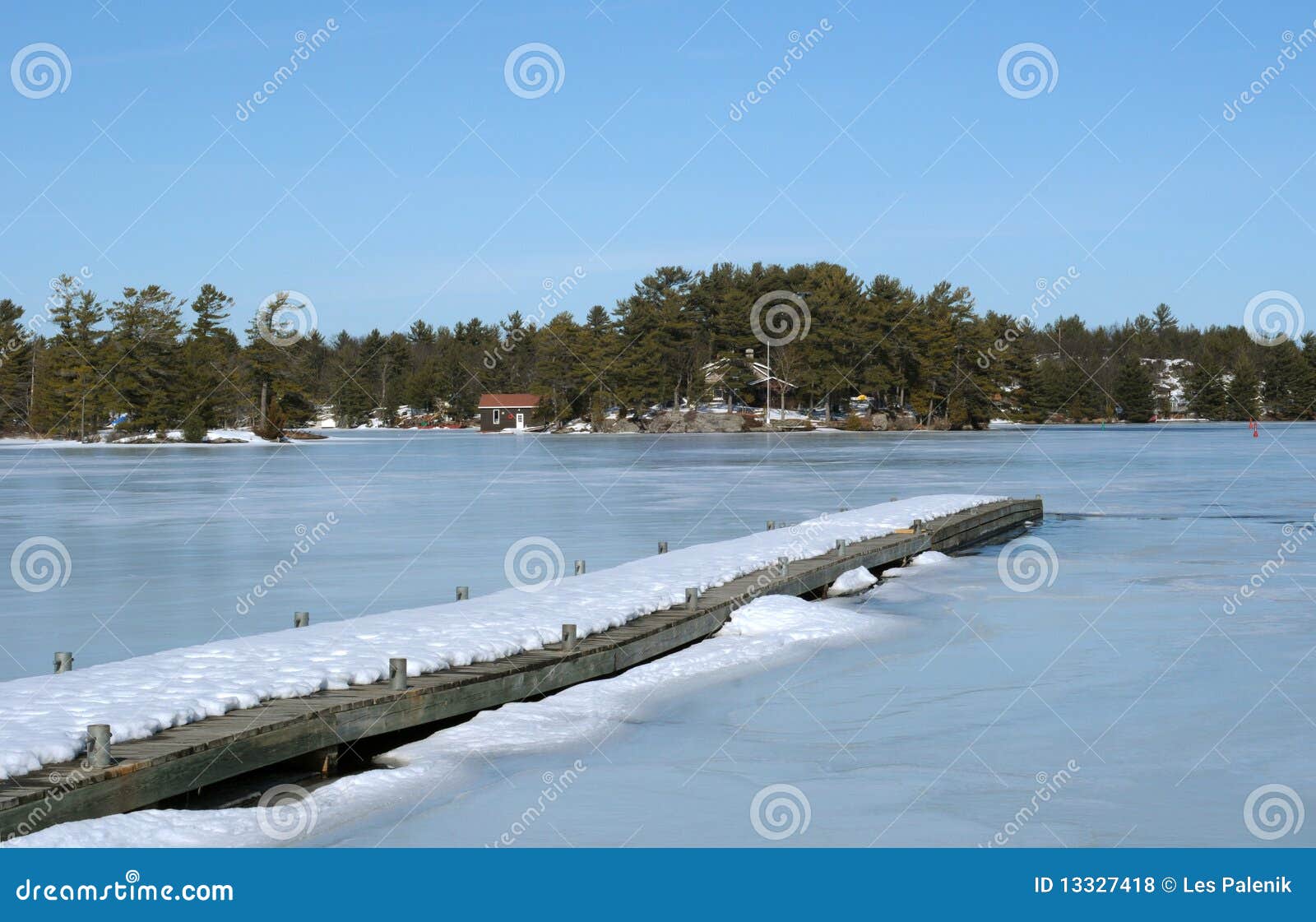 Dock Leading Onto A Frozen Lak Royalty Free Stock Photos - Image