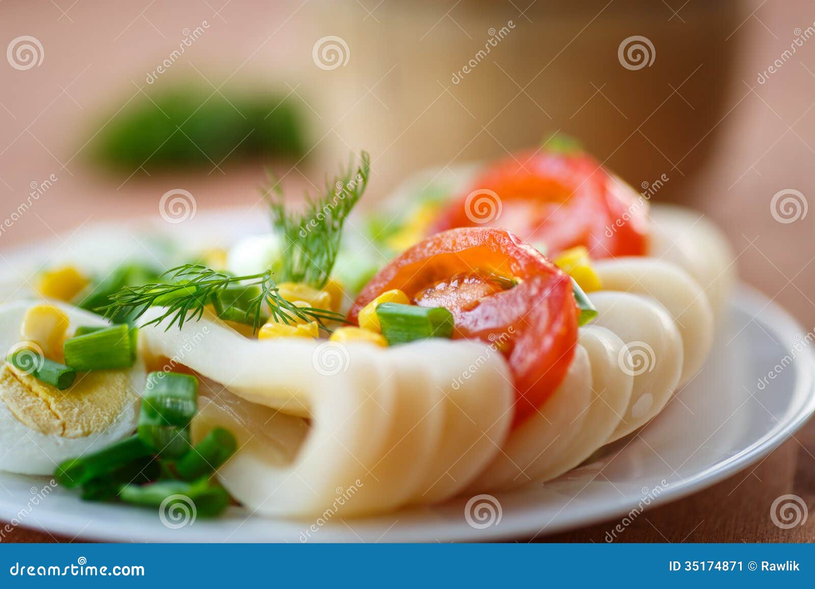 Egg salad and squid with green onions.