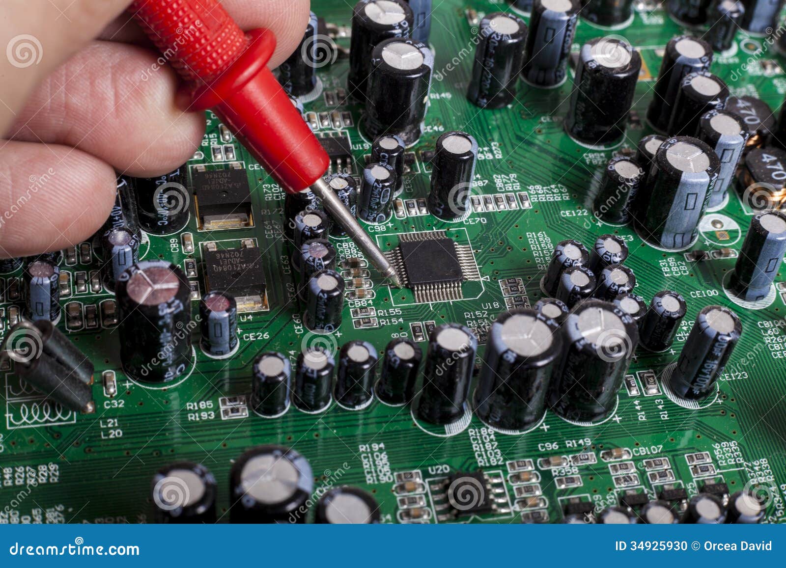 electronics-repair-service-close-up-red-probe-capacitors-electronic ...