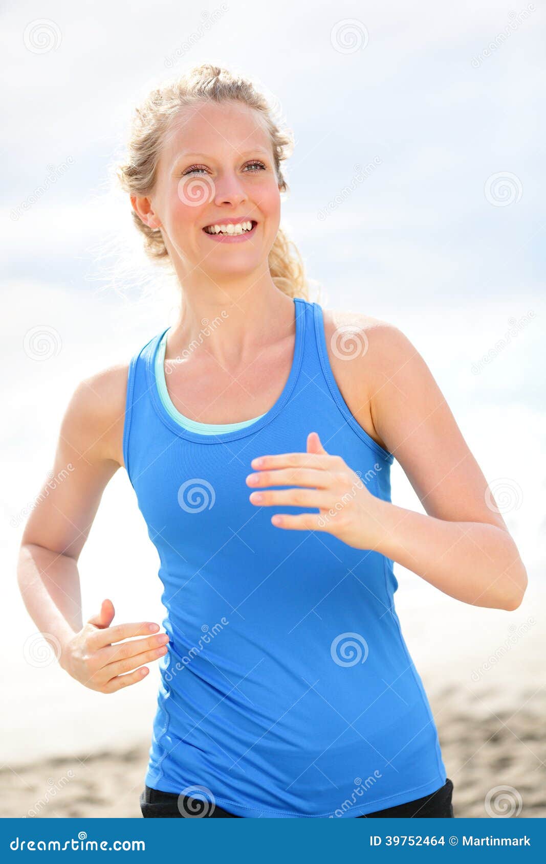 ... jogging happy on beach. Female runner athlete living healthy lifestyle