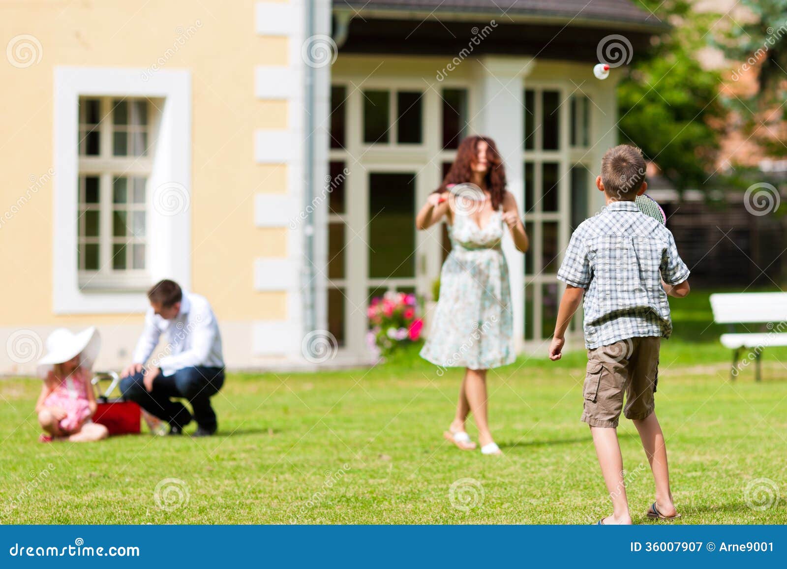 Family Is Playing In Summer In Front Of Their House Royalty Free ...