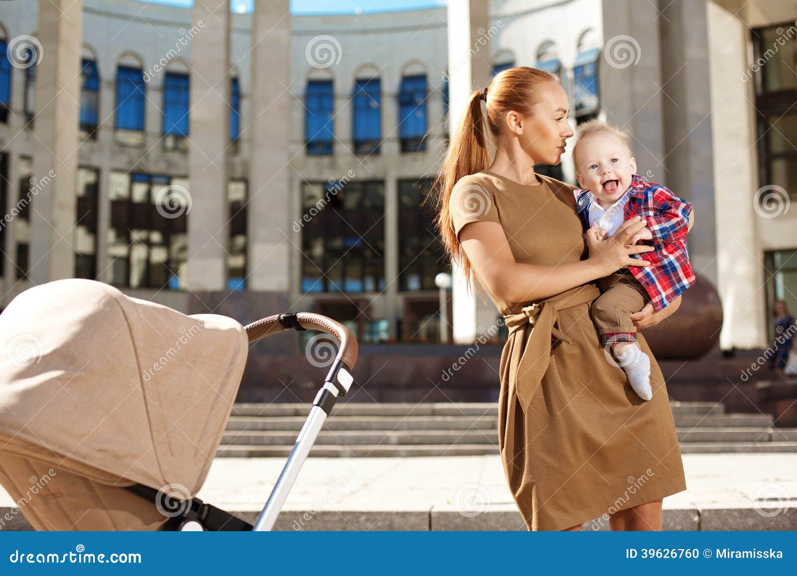 fashionable-modern-mother-city-street-pram-young-mo-trendy-walks-child-beautiful-women-child-39626760.jpg