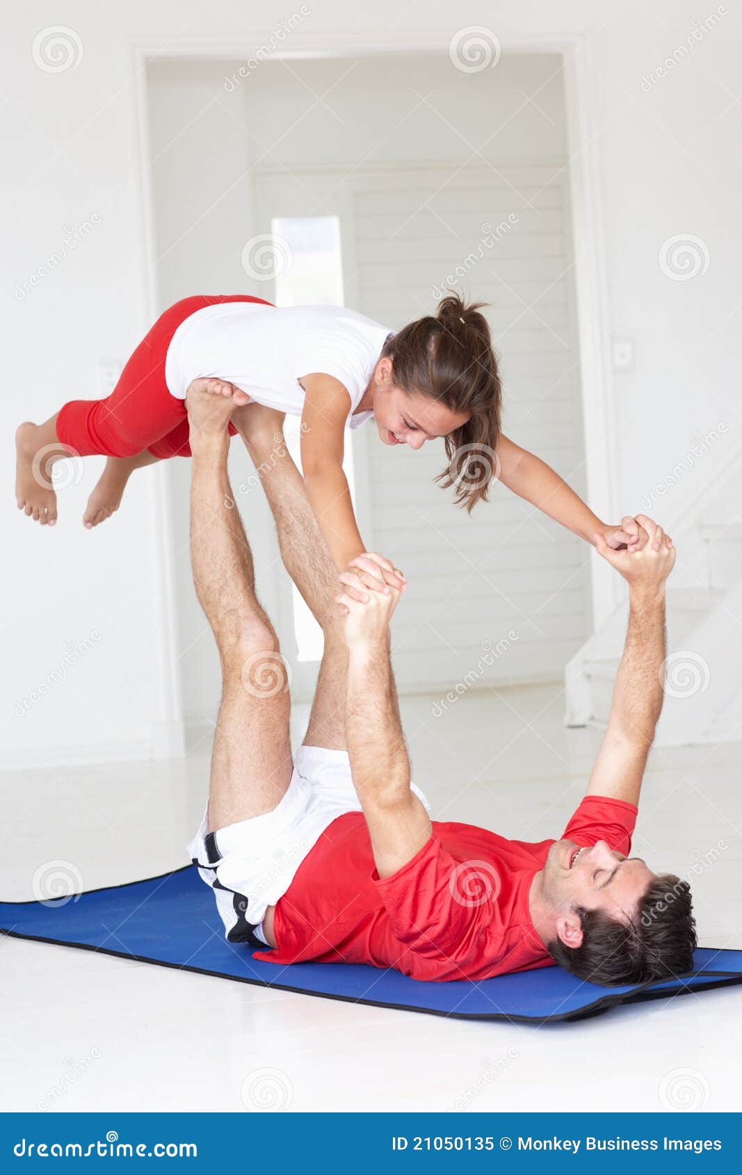 Father And Daughter Doing Yoga Lift Royalty Free Stoc photo