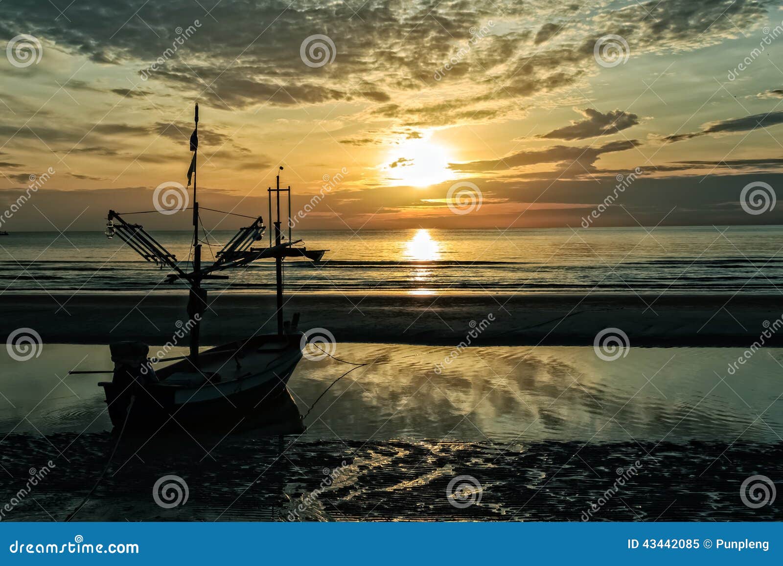 Seascape and Fisherman boat in dramatic sky.