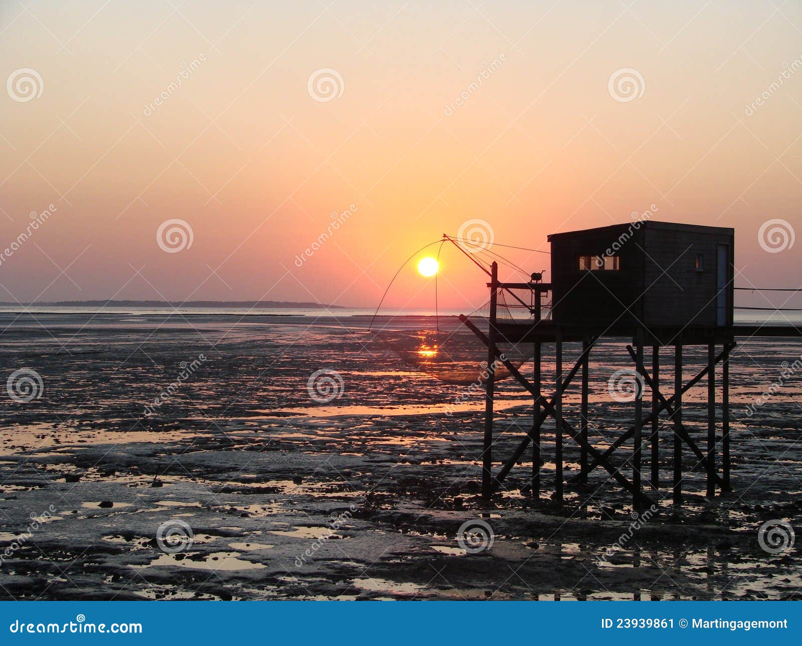 Sunset through the net of a fisherman cabin on the French Atlantic 