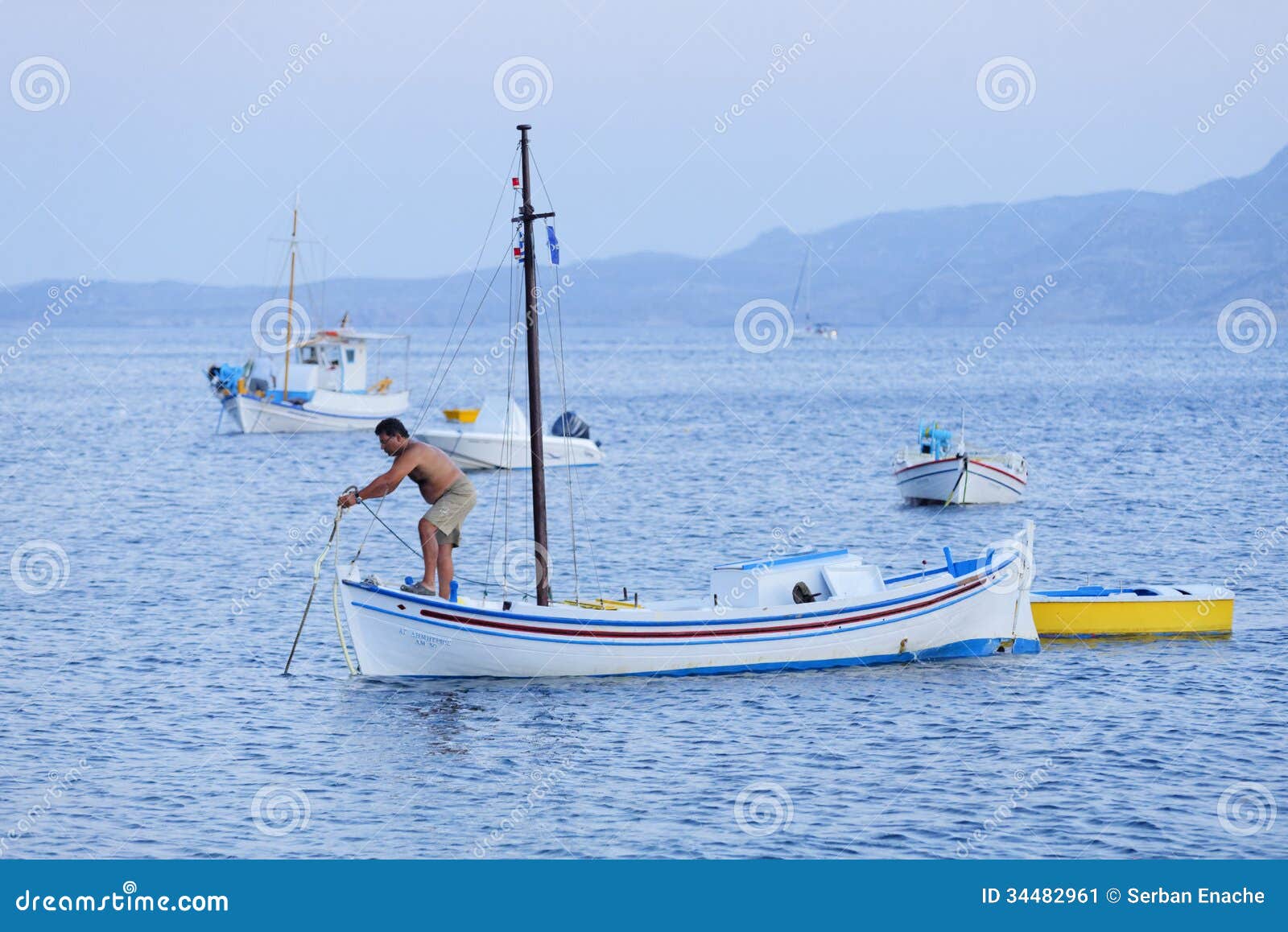  deck of his fishing boat. Photographed in Klima, Milos island, Greece