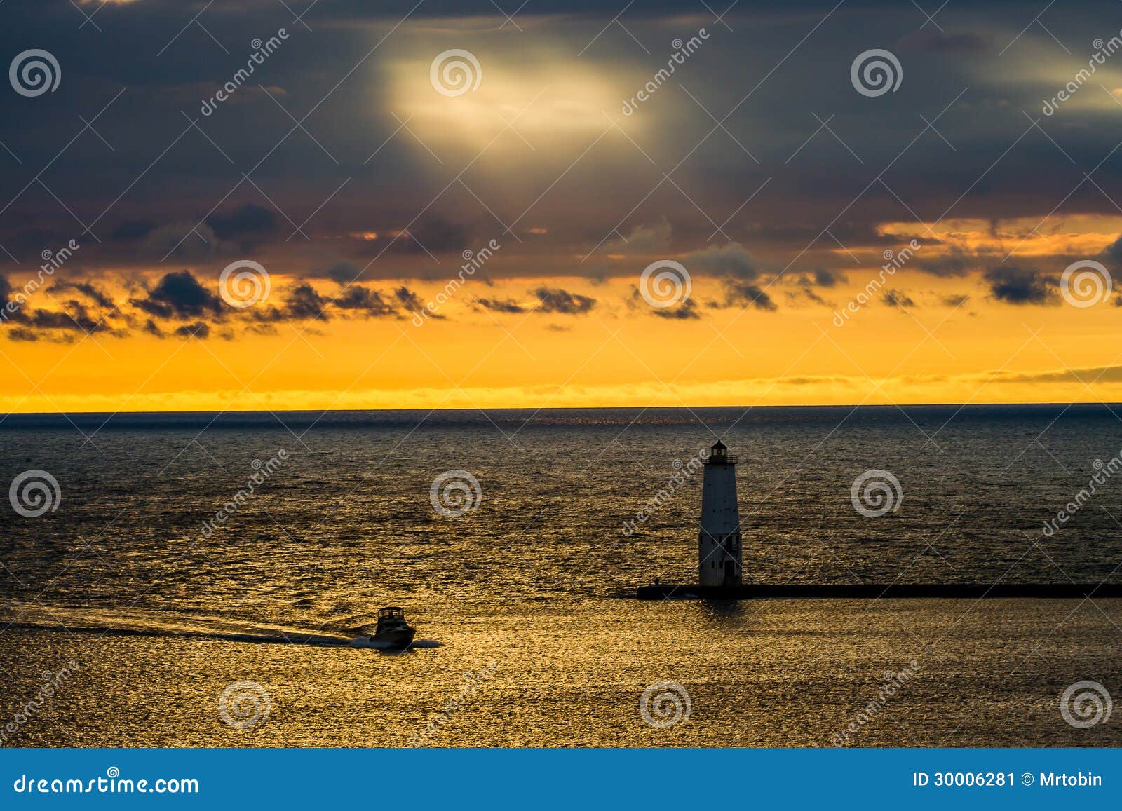 fishing charter boat enters Betsie Bay at the end of a long day of 