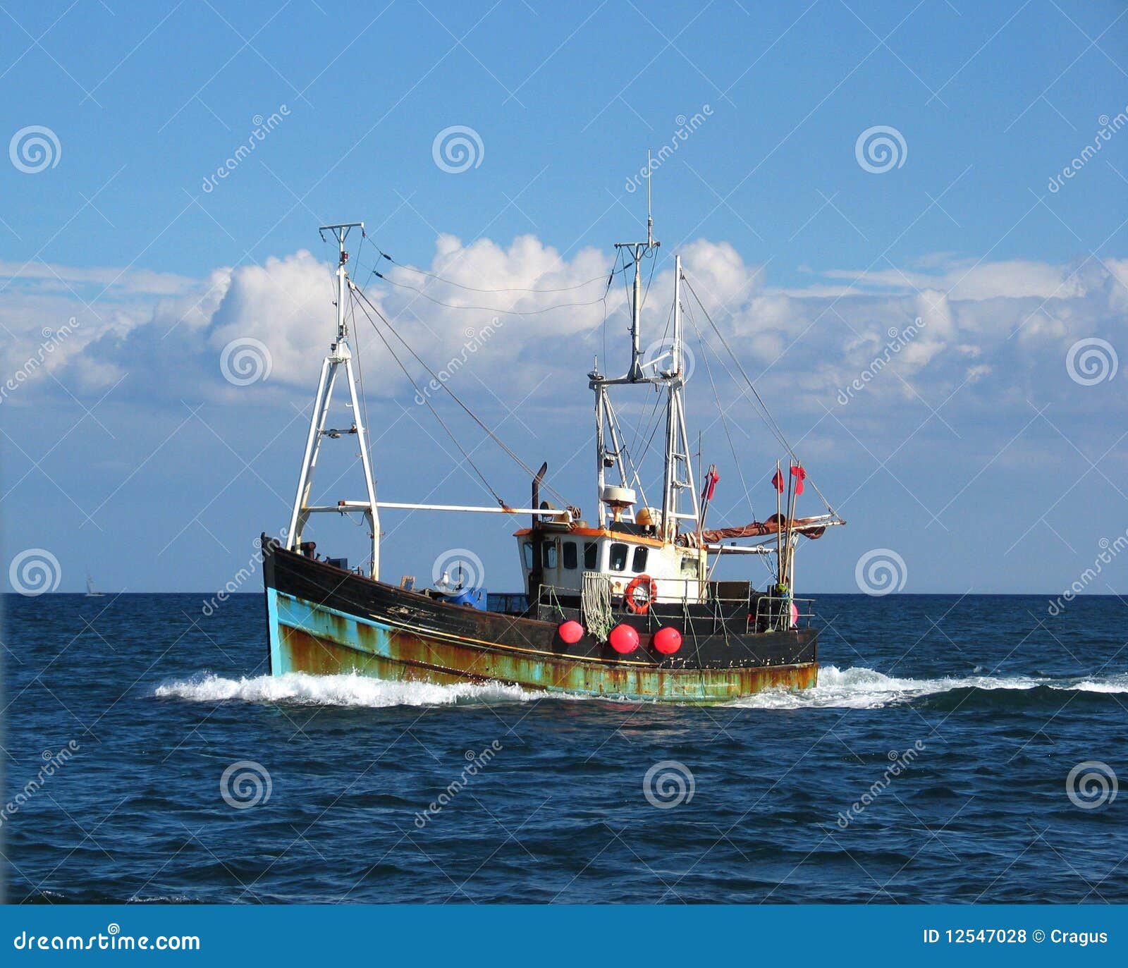 Classic style, colourful, rusty old fishing boat with a sea gull on 