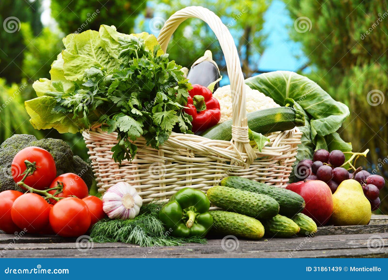 Stock Images: Fresh organic vegetables in wicker basket in the garden Stock Images: Fresh organic vegetables in wicker basket in the garden