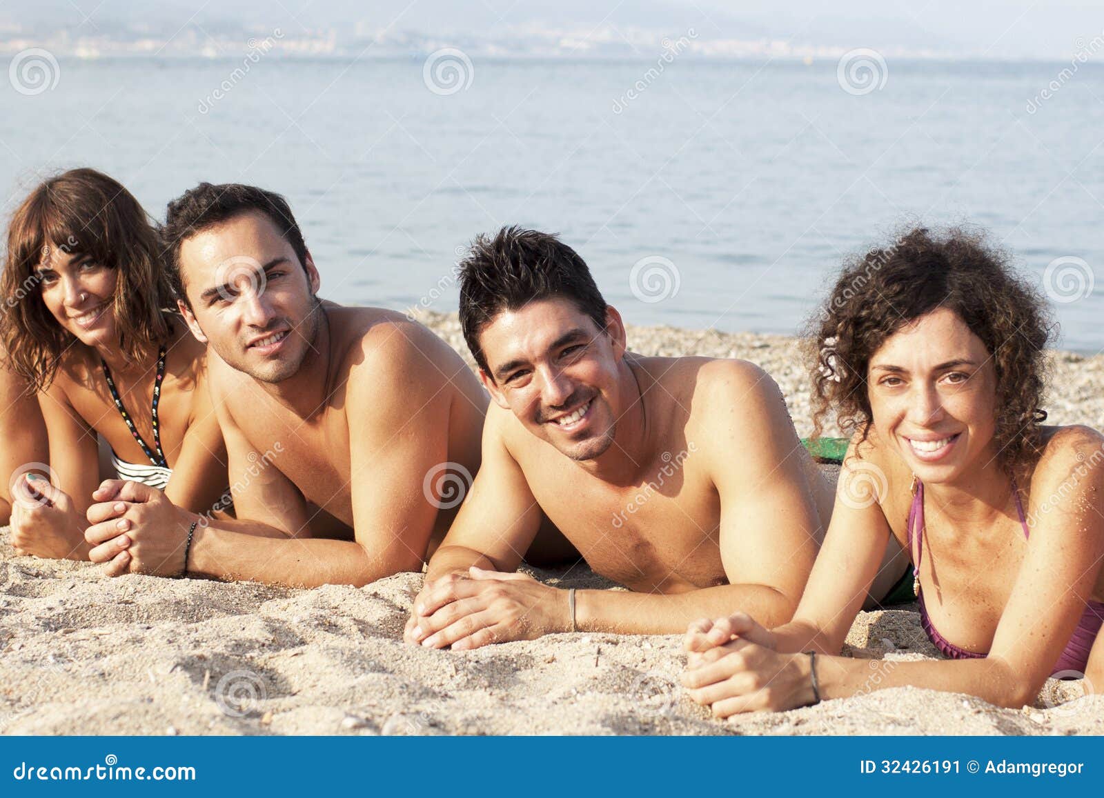 Lying On The Beach With Friends