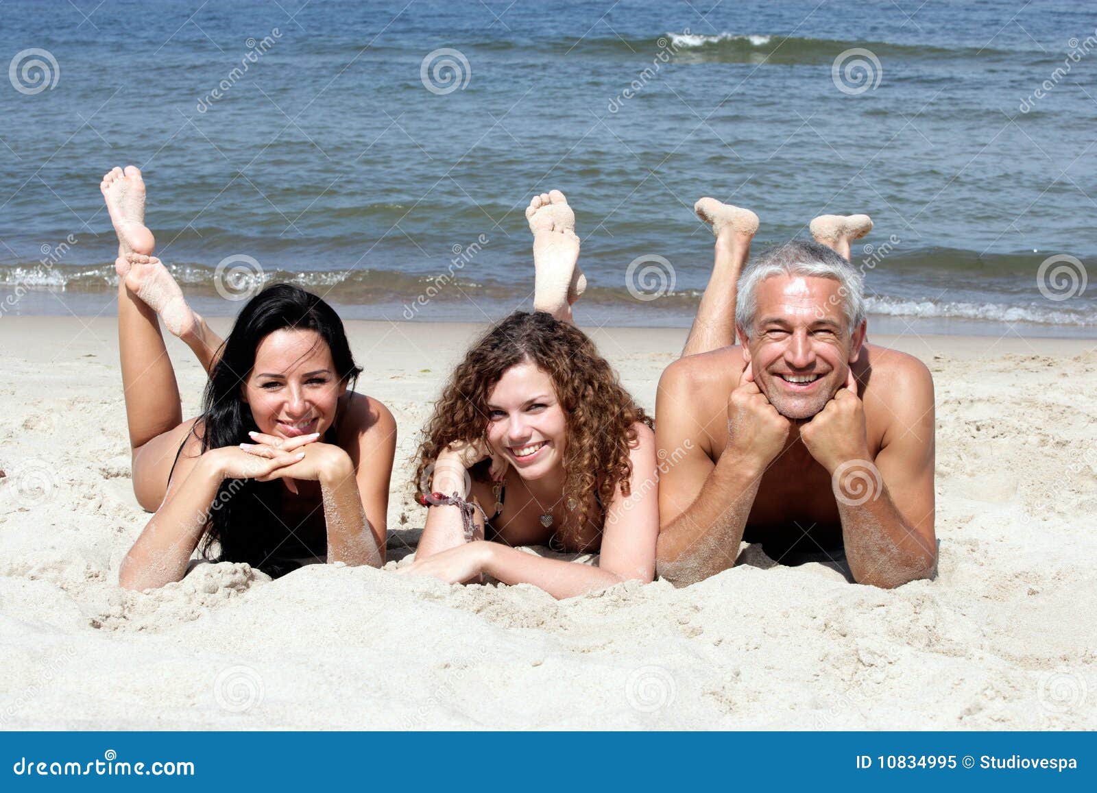 Lying On The Beach With Friends