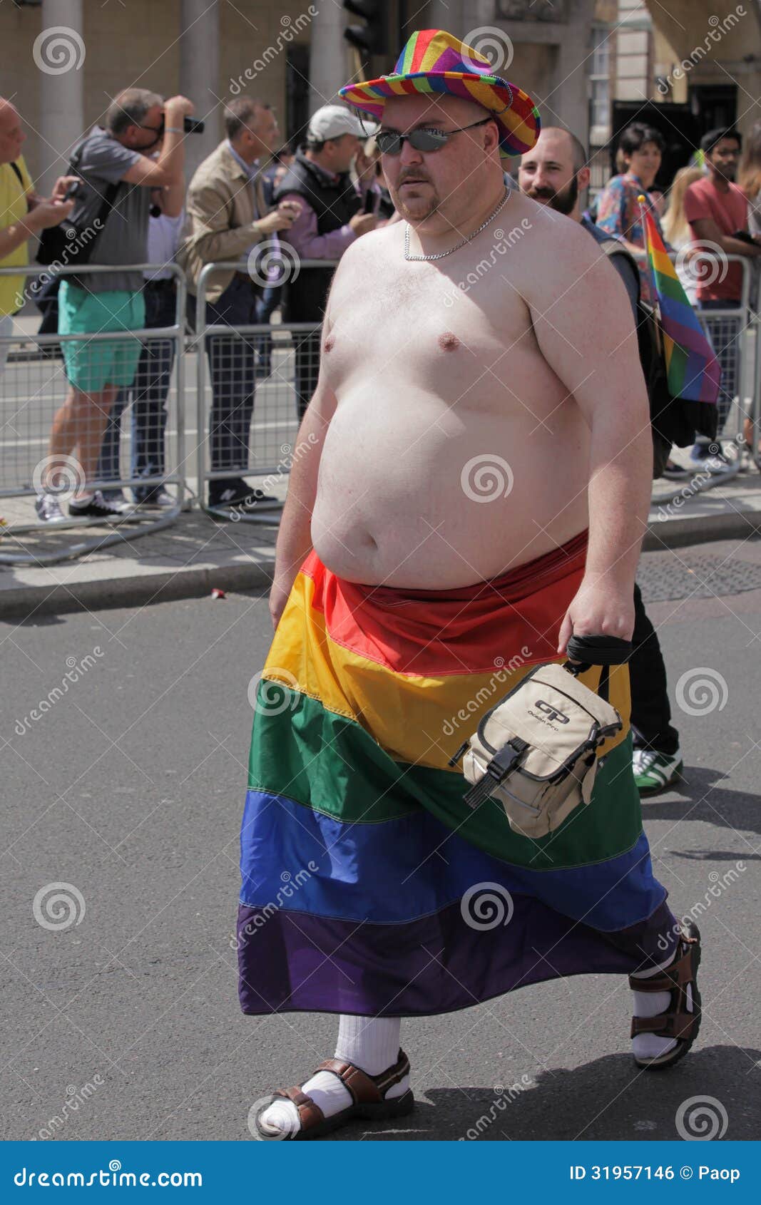 gay-rainbow-flag-portrait-manwith-naked-torso-wearing-below-waist-lesbian-pride-parade-london-31957146.jpg