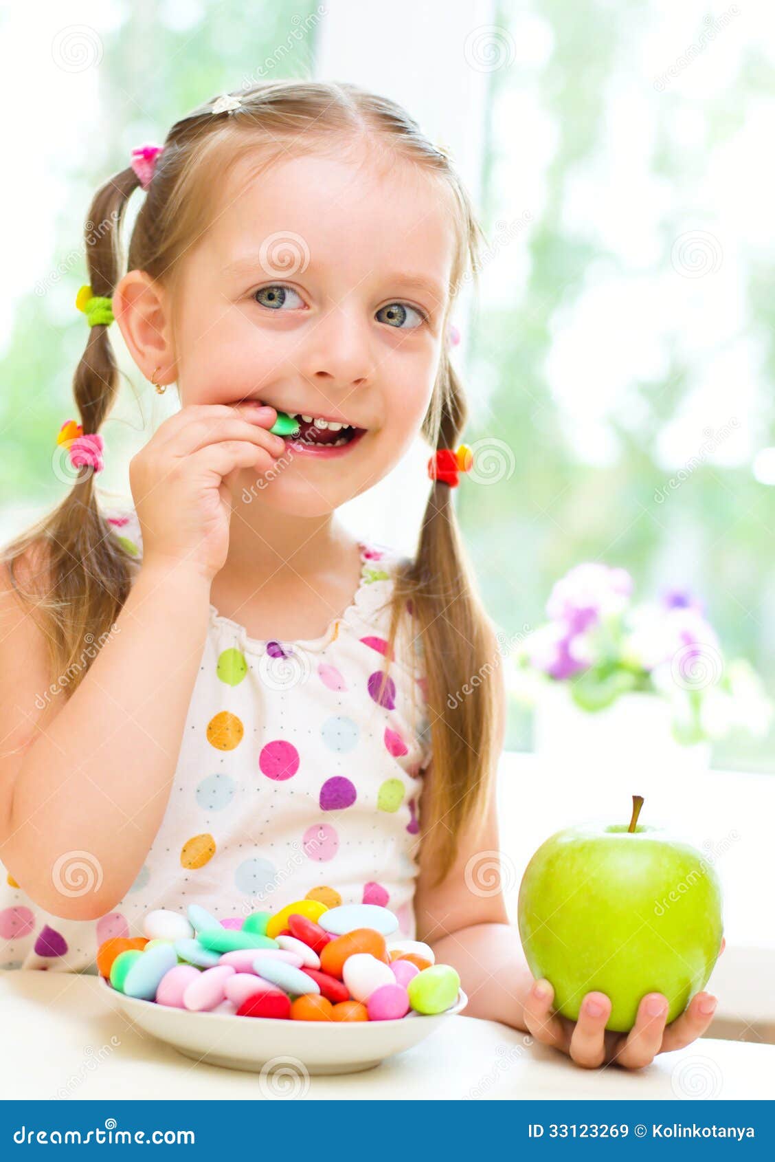 Girl Eating Candies Royalty Free Stock Images - Image: 33123269