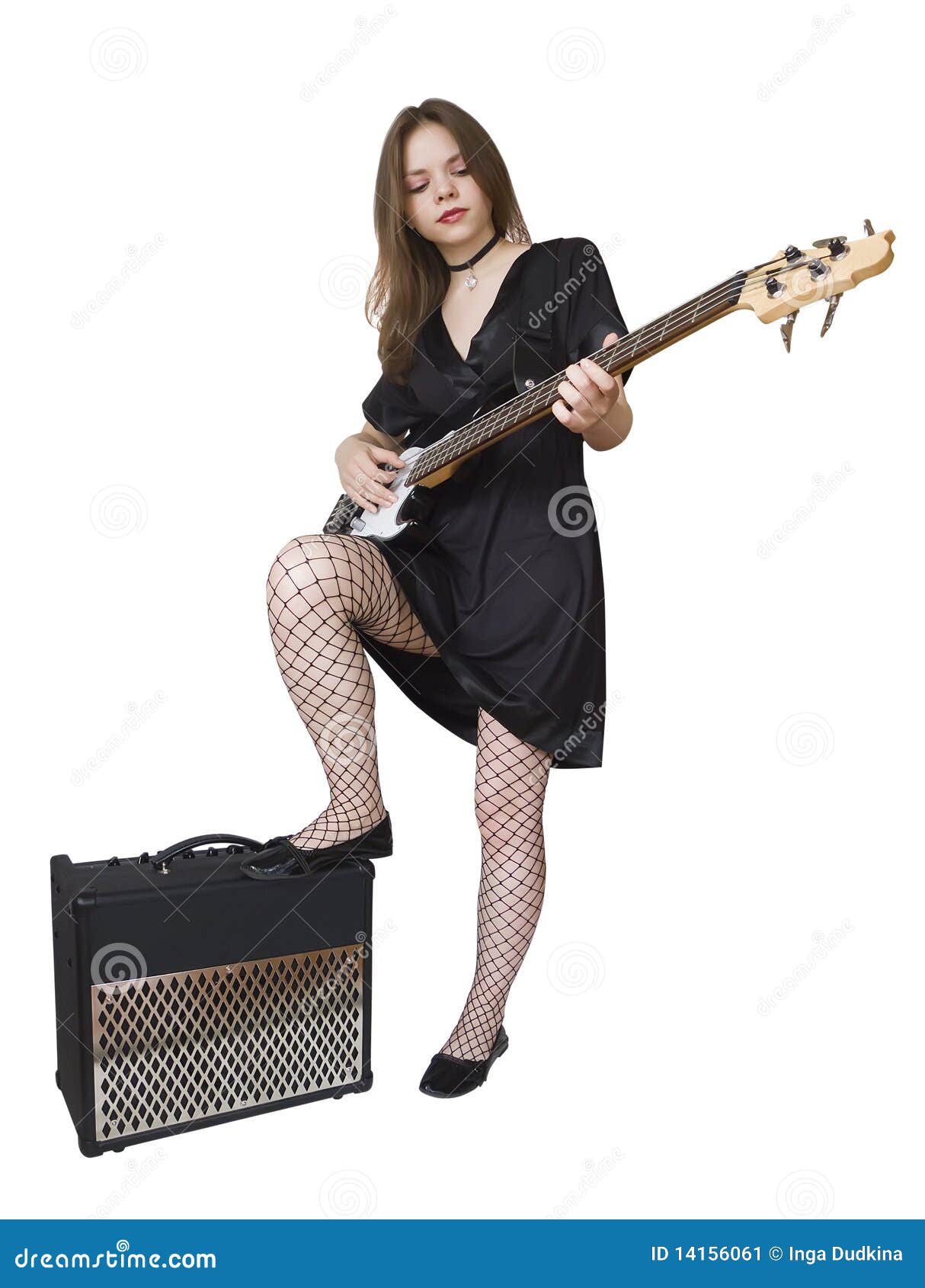 Teen girl standing with electric bass guitar.