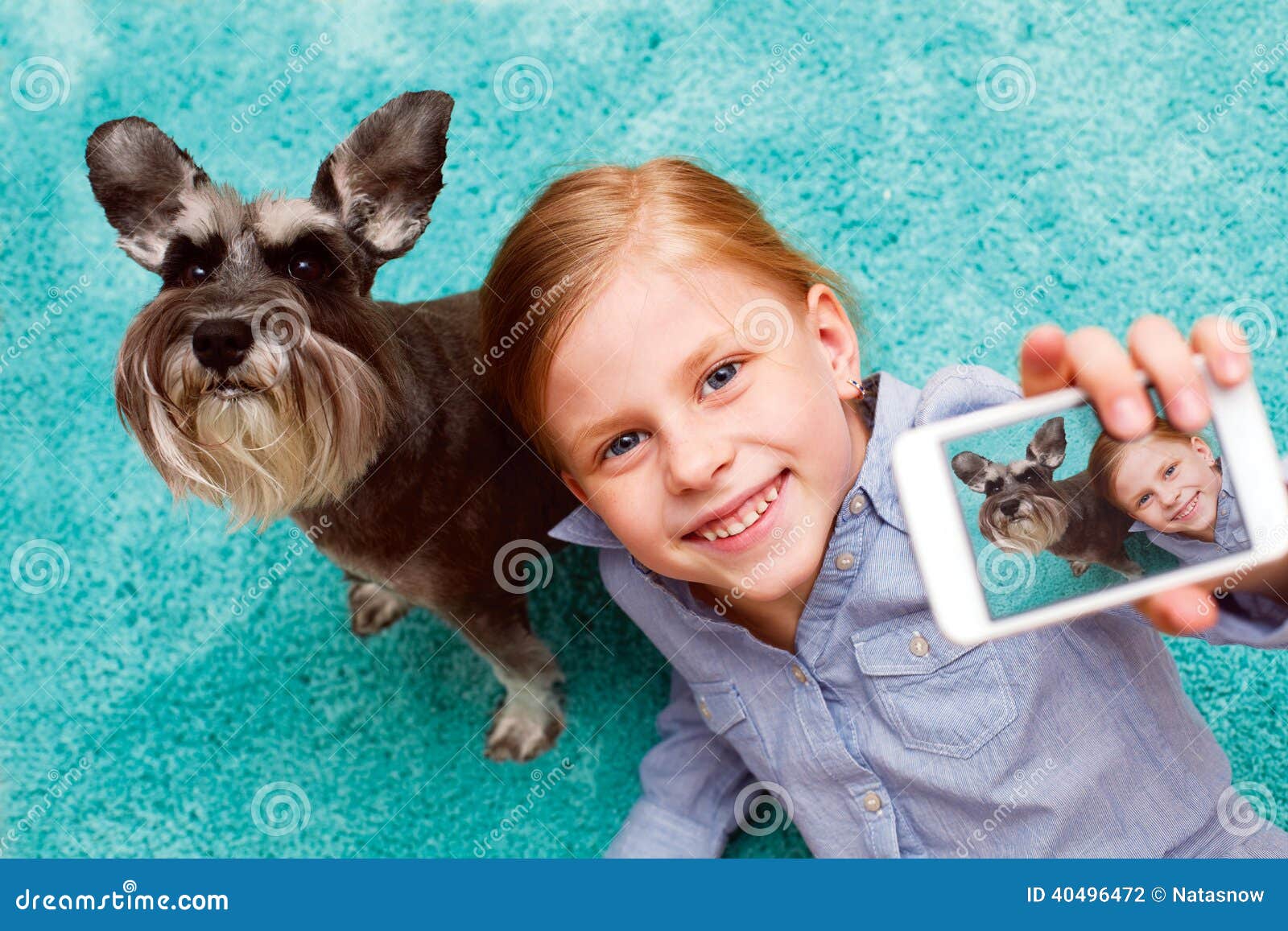 Girl Photographing Herself And Her Dog Stock Photo