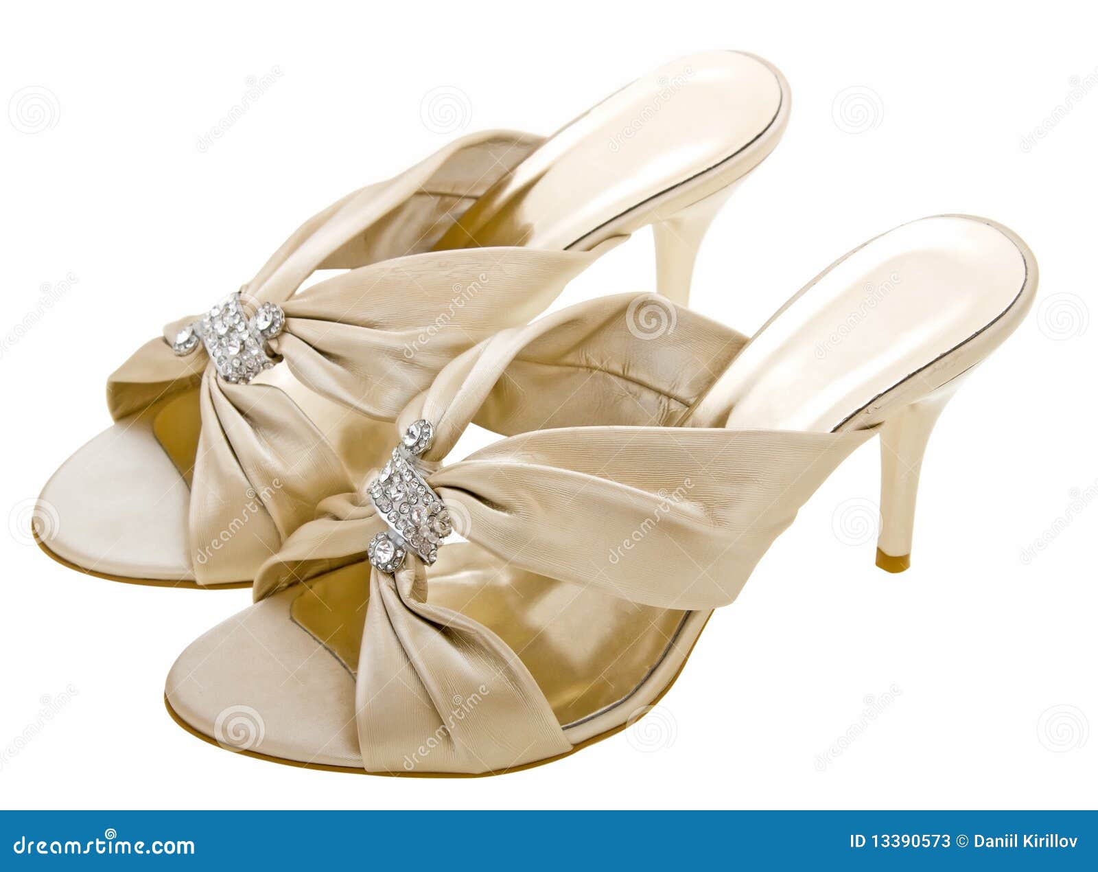 Gold women shoes isolated on white background.