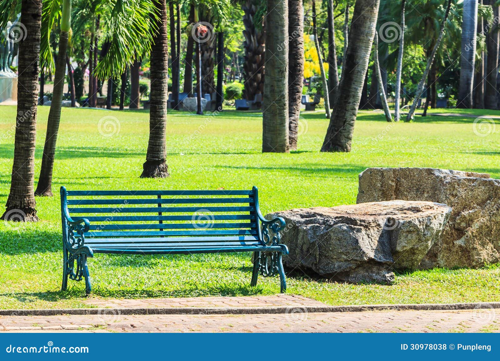 Green Bench In Palm Garden Background Royalty Free Stock Photos 