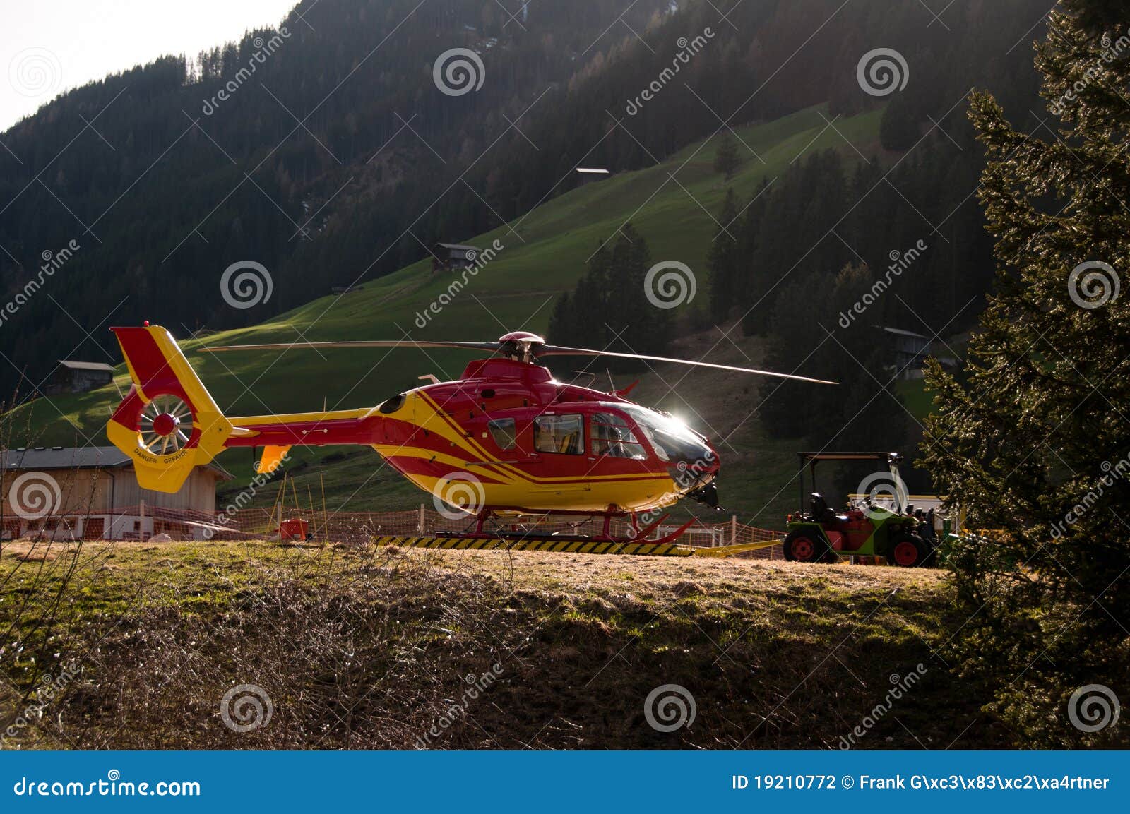  - grounded-yellow-red-helicopter-hangar-19210772