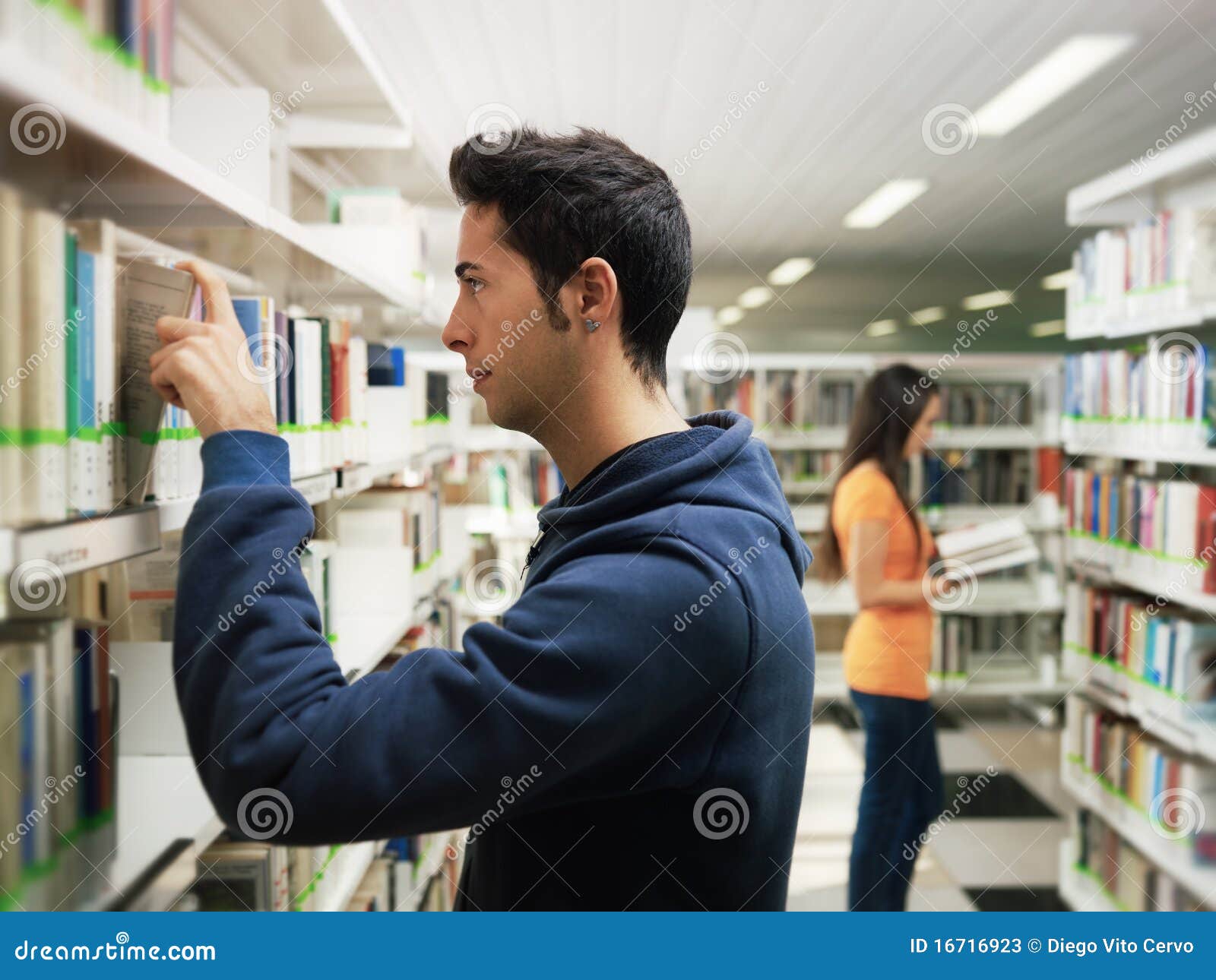 guy-taking-book-shelf-library-16716923.jpg