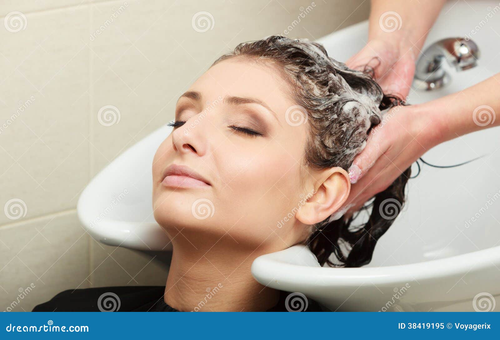 Hairstylist washing woman hair. Hairdressing beauty salon - hairstylist-washing-woman-hair-hairdressing-beauty-salon-38419195