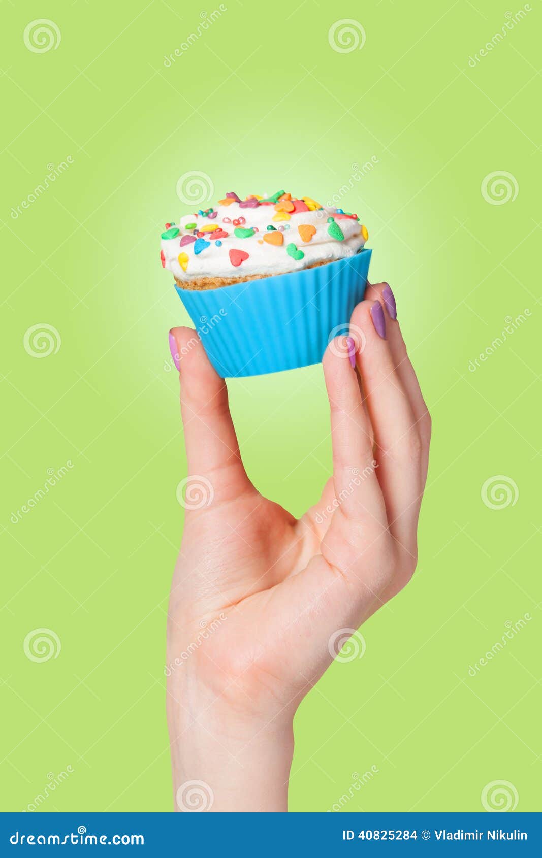 hand-holding-cupcake-green-background-40