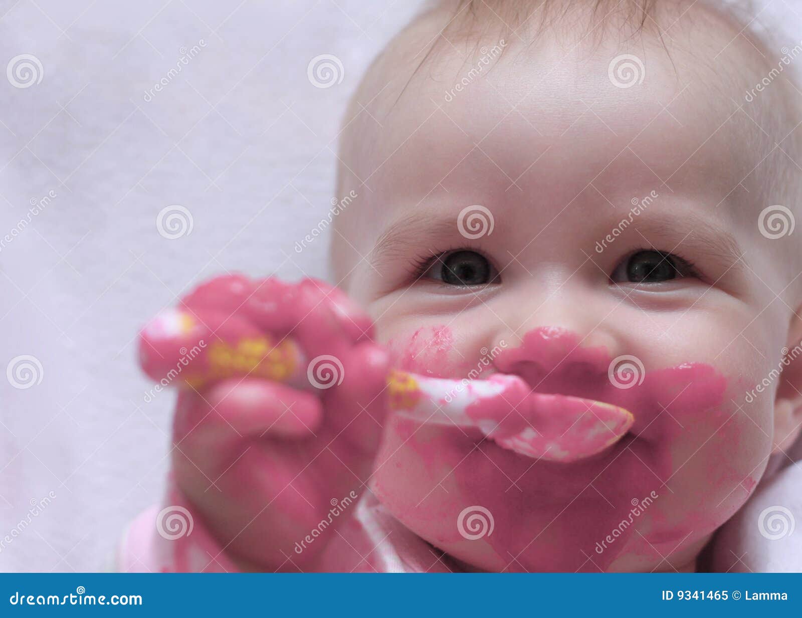 Happy Baby With A Spoon In The Mouth Royalty Free Stock ...