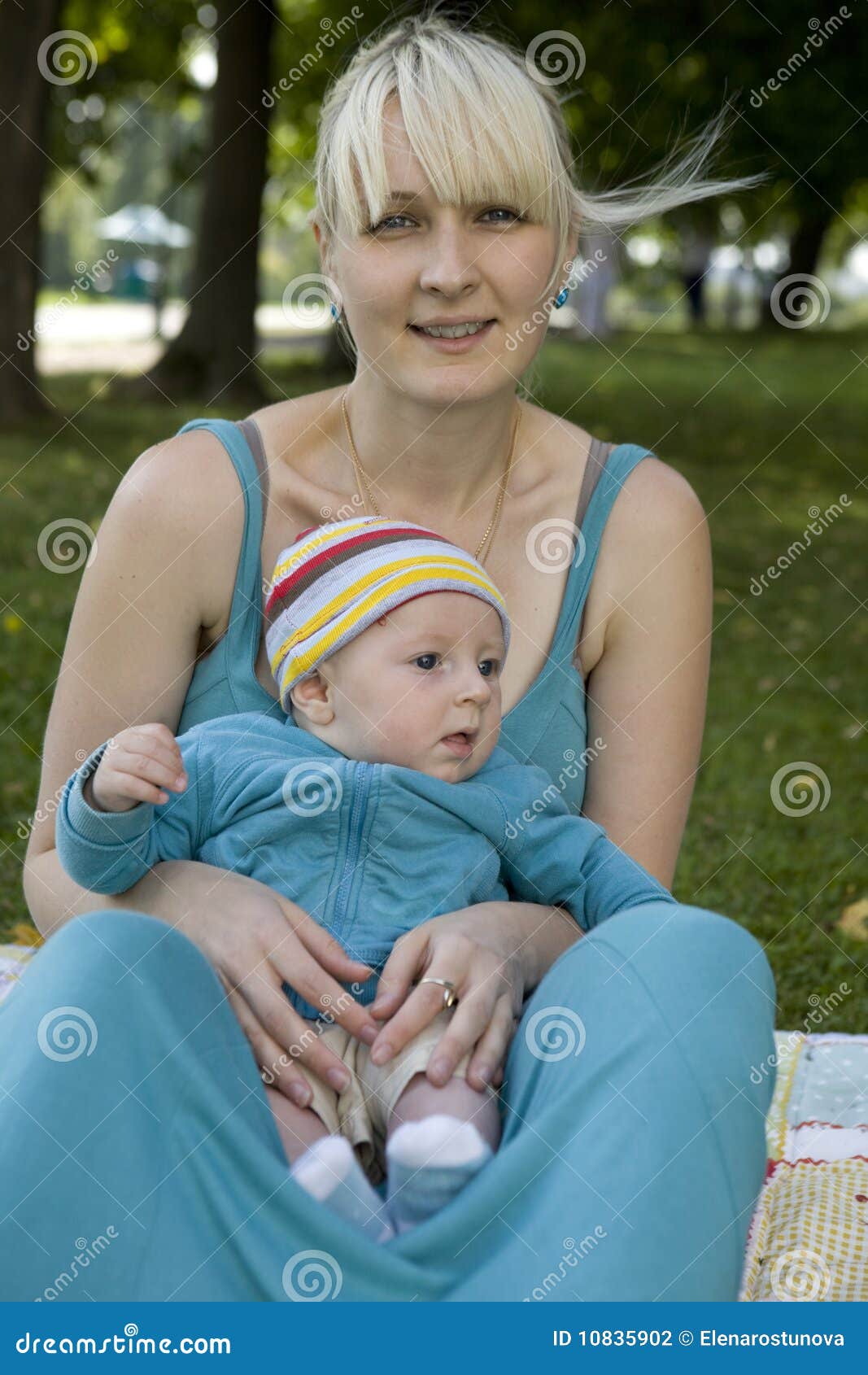 Happy Blond Mother Holding Her Baby Stock Photo Image Of Jolly