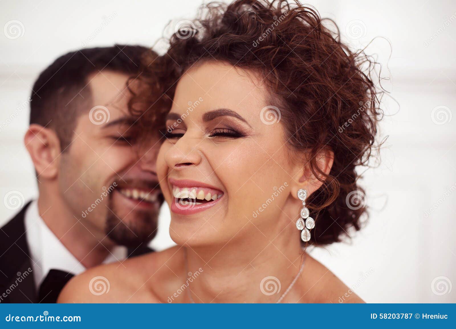 Happy bridal couple - happy-bridal-couple-smiling-embracing-58203787