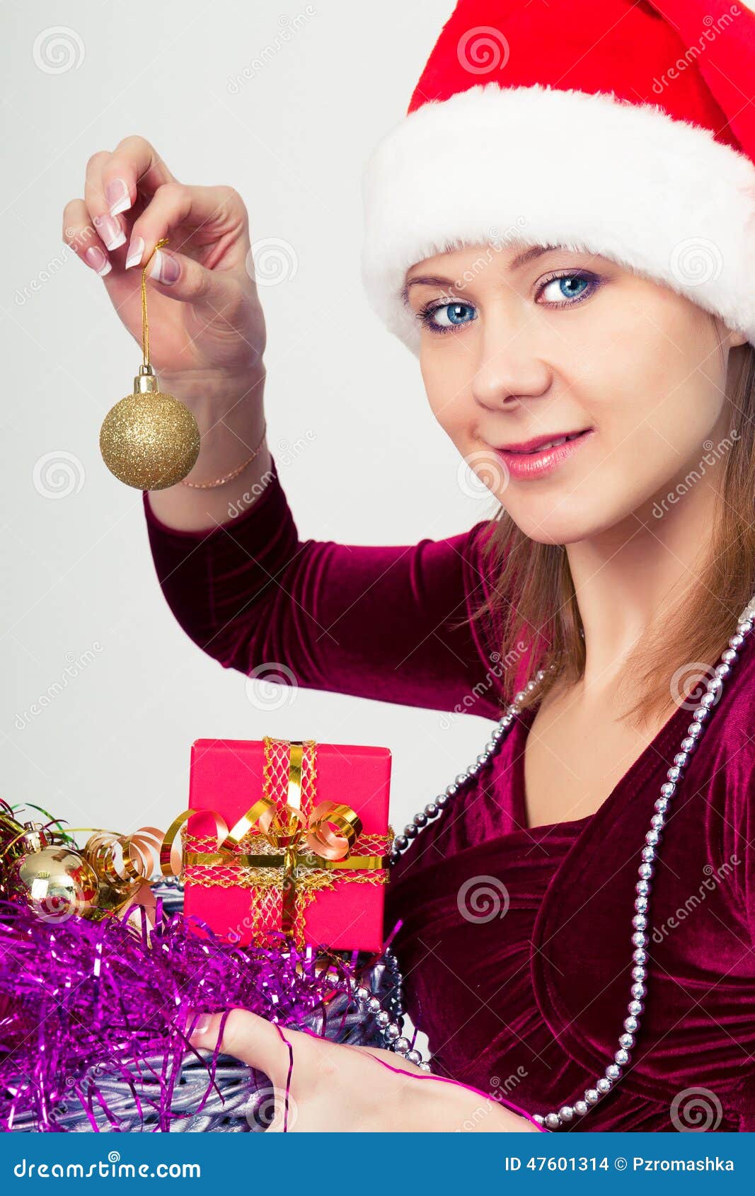 Happy girl in santa hat with gift boxes - happy-girl-santa-hat-gift-boxes-attractive-47601314