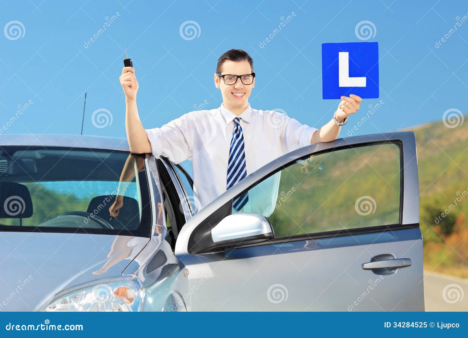 happy-man-posing-near-car-holding-l-sign-key-having-h-young-his-his-driver-s-licence-road-34284525.jpg